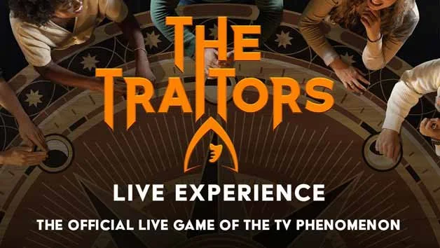 The Traitors - Participants sat around a table