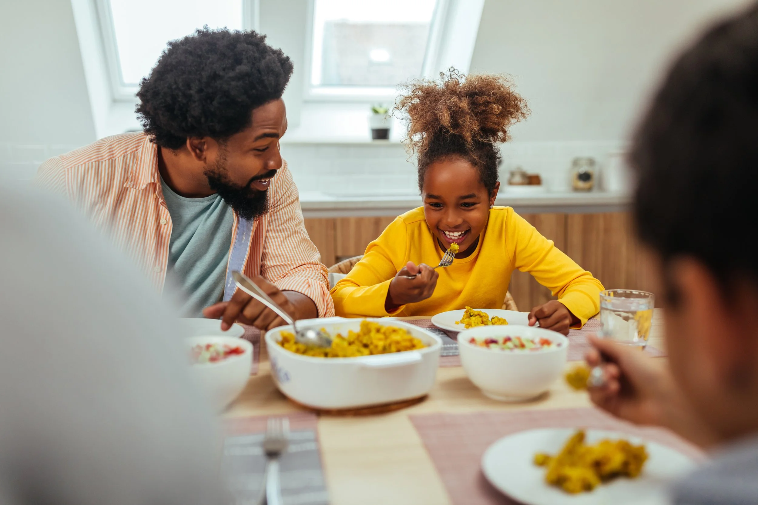 family happy eating a healthy meal