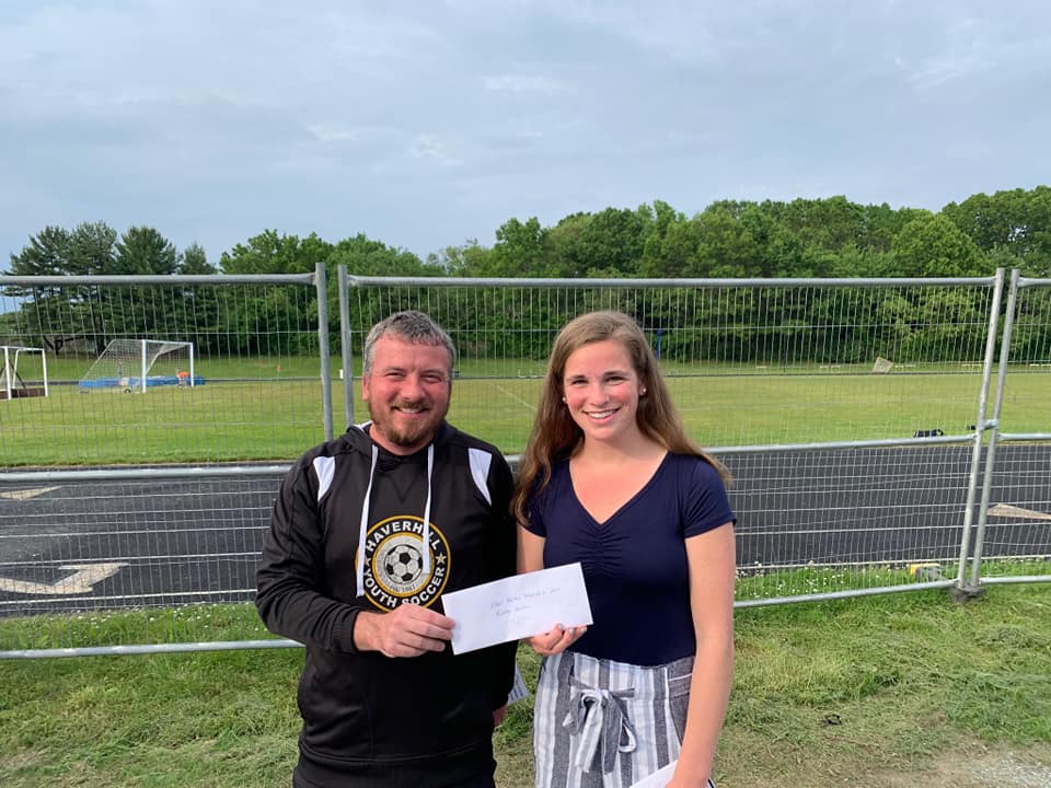Haverhill Youth Soccer President David Lefcourt presents the Neal Harvey Memorial Scholarship to the 2019 recipient Katelyn Quinlan.