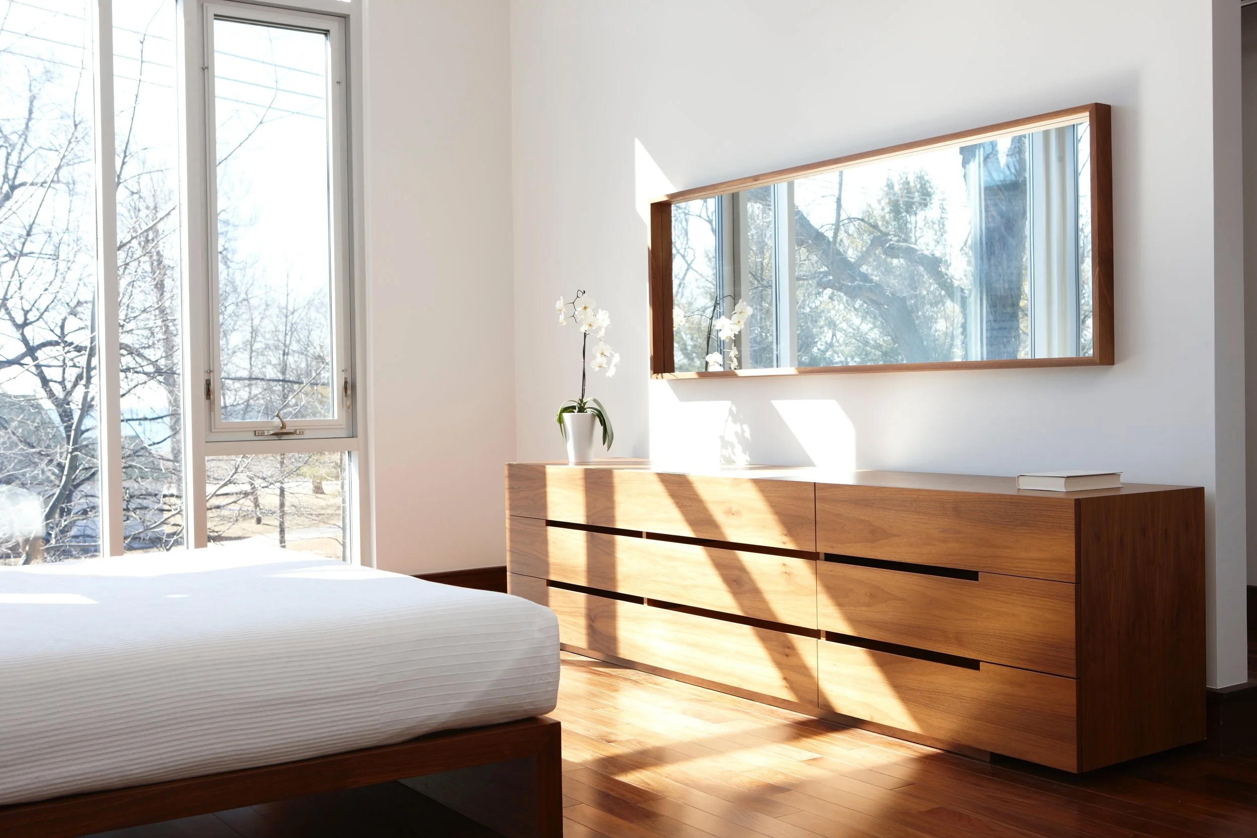 Custom furniture complements the home’s materials and details.