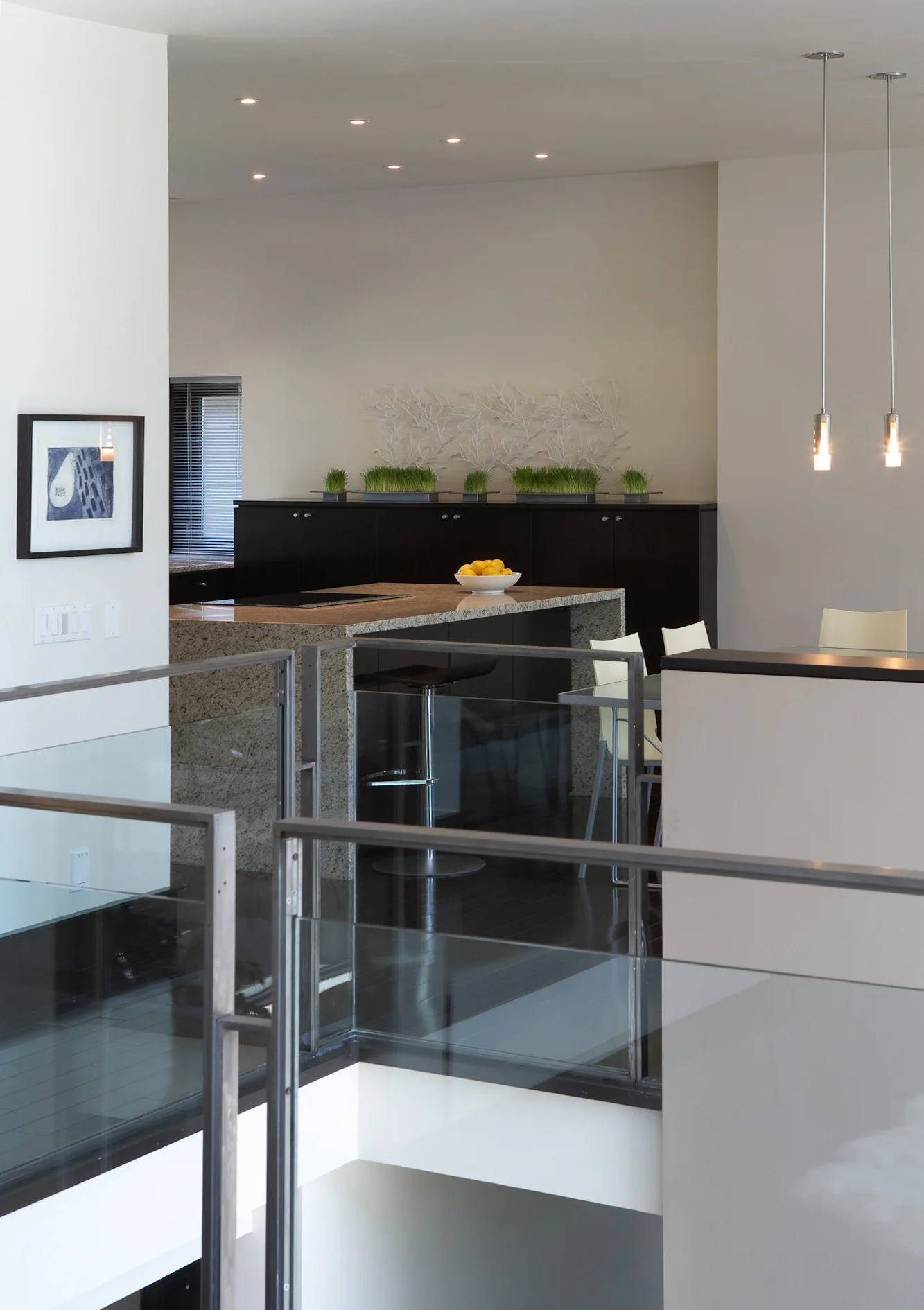 A large central floor opening to the basement separates the casual family zone (kitchen, dinette and family room) from the more formal living and dining area.