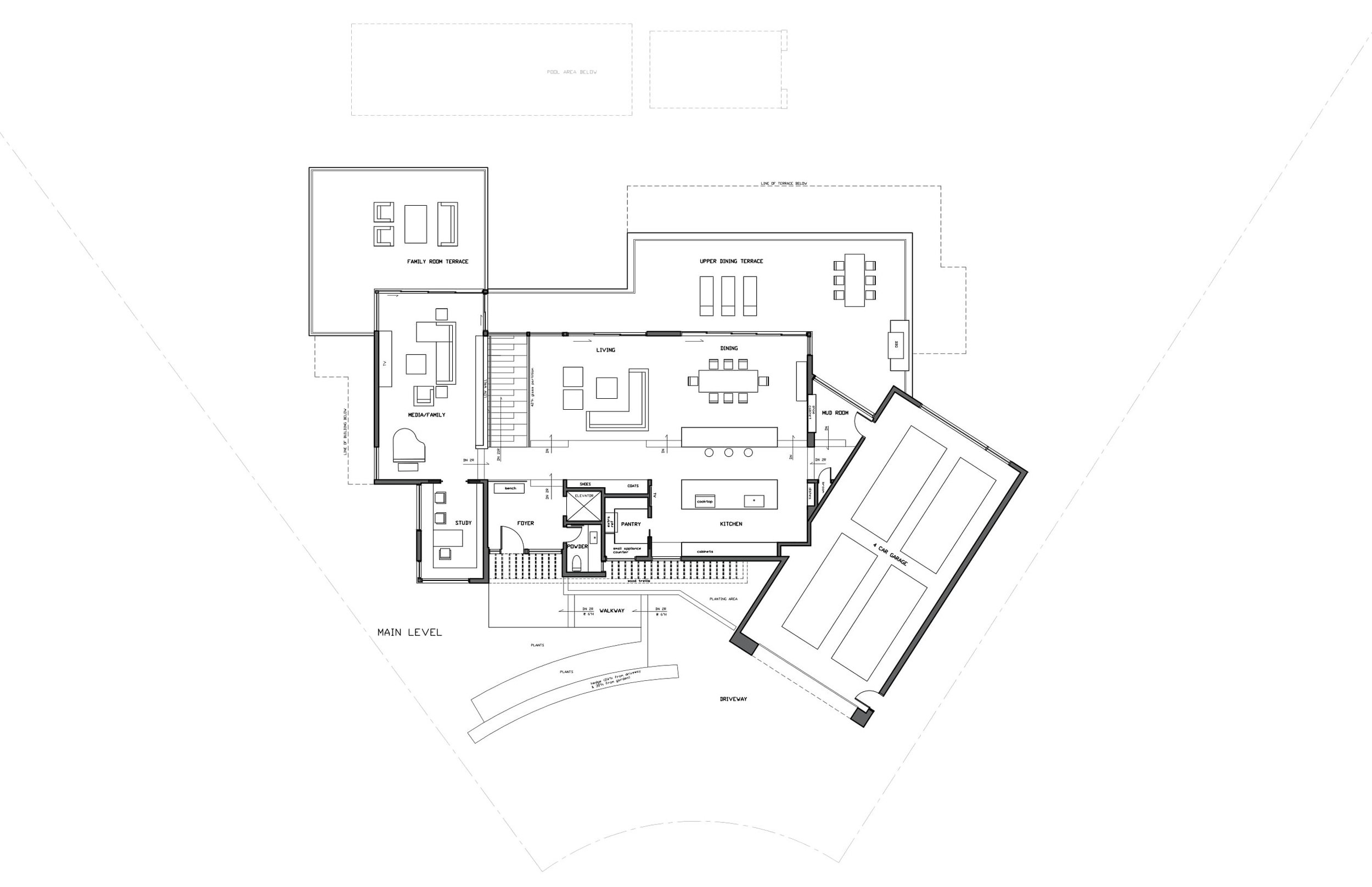 The kitchen, positioned at the front of the house, is elevated by two steps overlooking the dining room towards the ocean. The level change increases the height of the dining and living areas to 11 feet while conforming to the height restriction. The breakfast counter straddles both levels and serves as storage from the lower dining level.