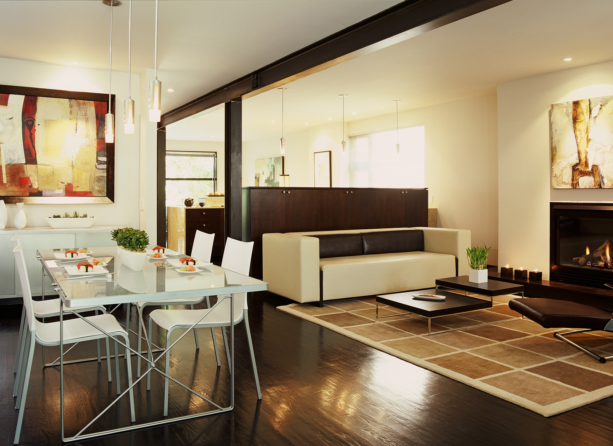 In lieu of standard upper cabinets and a wall to support them, the 4ft high dish cabinet in the background is accessed from both the living area (adjacent to the dining room) and the kitchen. The low height facilitates access to all the shelve