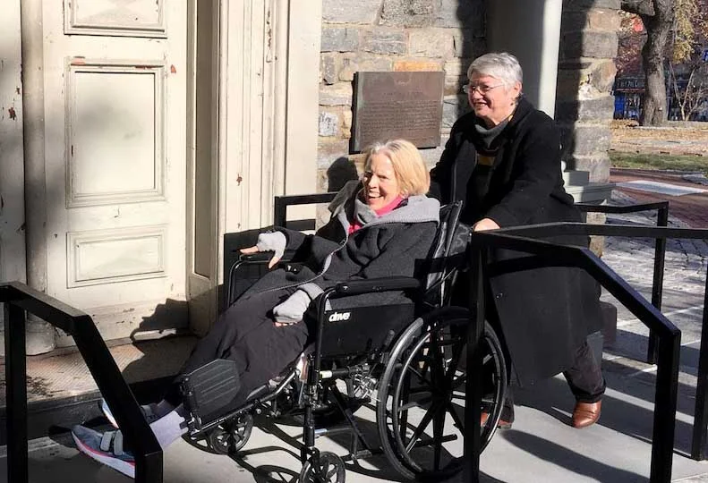 St. Mark’s parishioner Linda Tarnay enjoys the church’s new ramp for the first time.