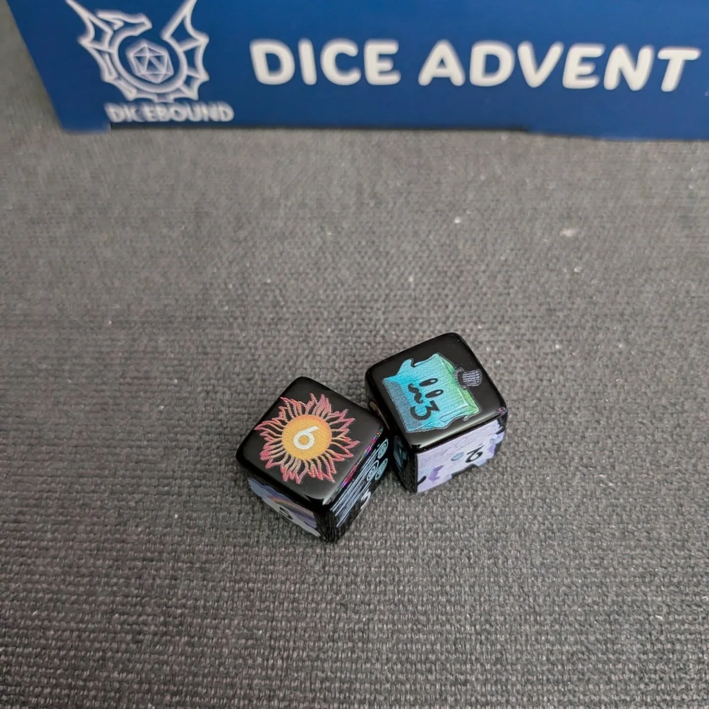 Tonight from @dicebound we have #day8 of the #diceadventcalendar revealing 2d6 that are themed to the adventure book. They are awesome! I the glimmercat and Goomeo is so much fun. #merrycritmas #dicefordays #DicemberDaily #dicecollection #allthedice 