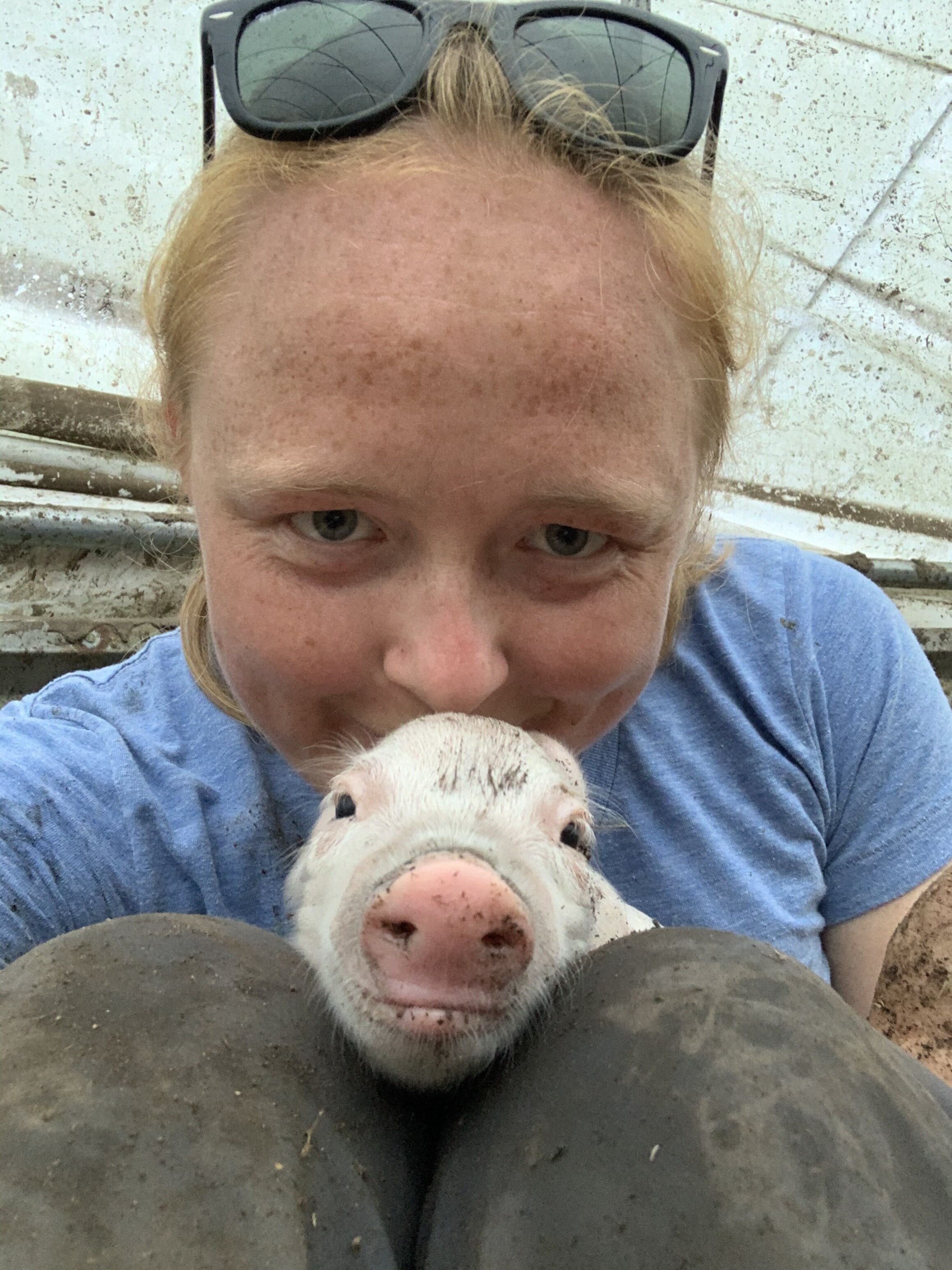 Kate and just born piglet.jpg