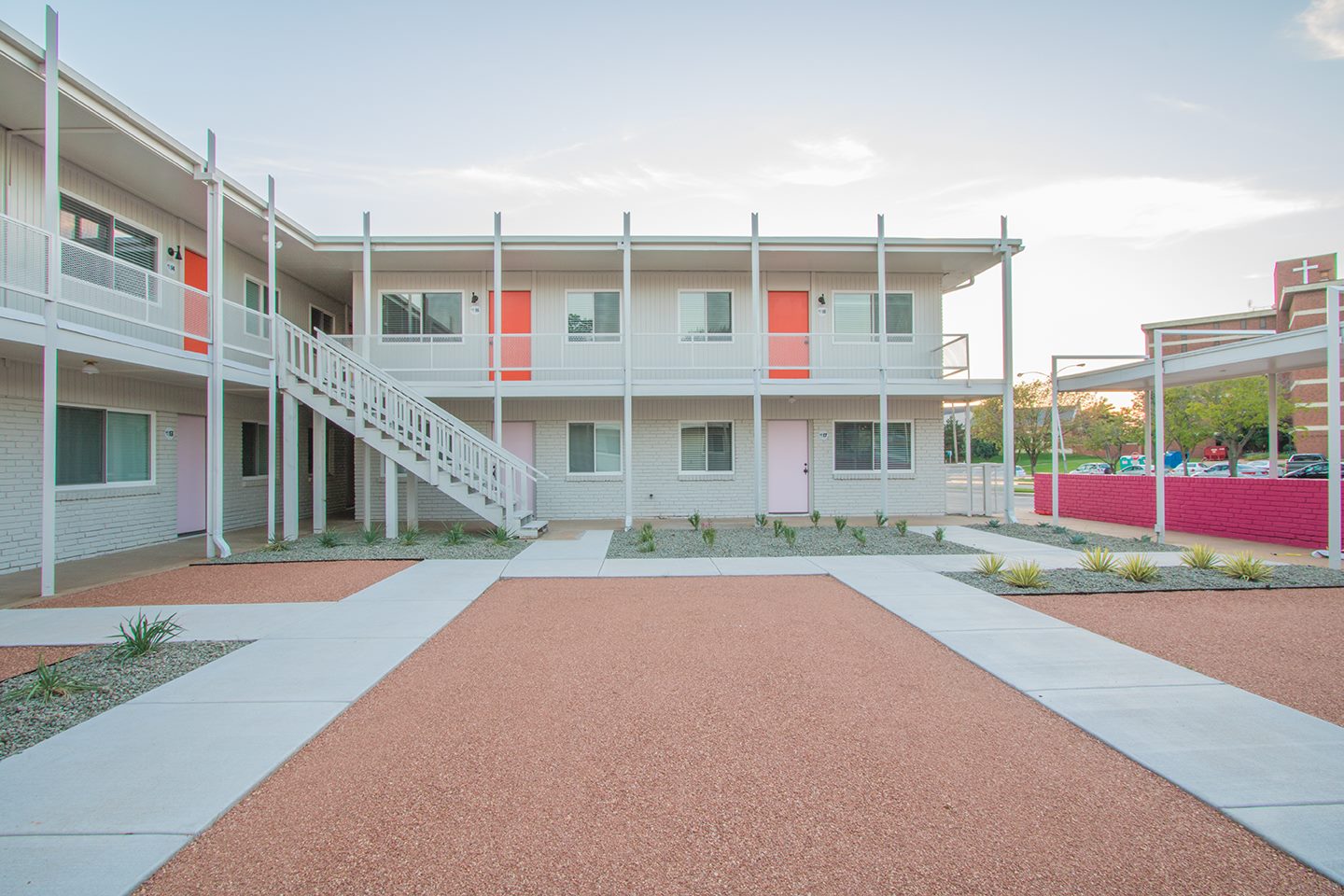  Concrete paths define blocks of aggregate and low water plantings that keep maintenance to a minimum and complement the lines of the buildings. 