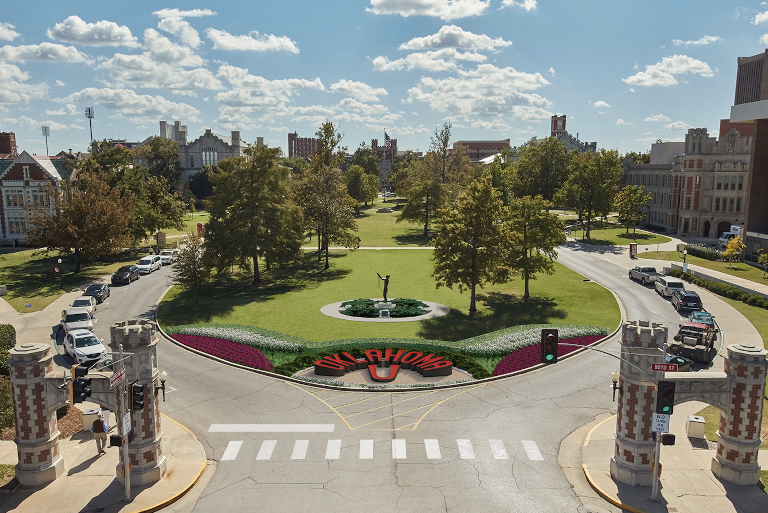  The final concept included formalized planting beds framed with a structural hedge. Beyond, the square planting bed around the May We Have Peace sculpture by Allan Houser is rounded into a circle. This complements the curve cut by the Oklahoma U let