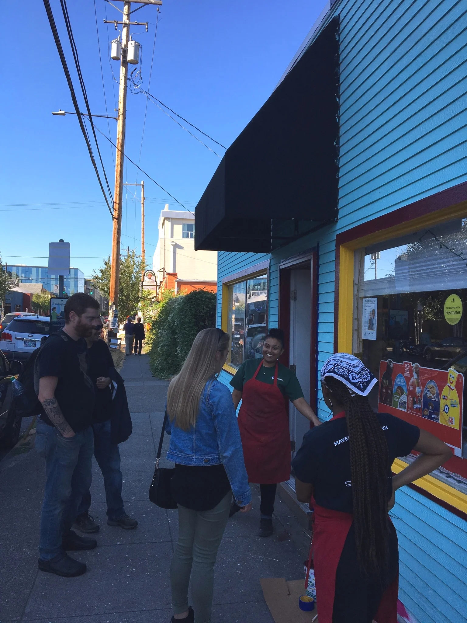  Saleshni engaging with passerbys on paint color preferences.  