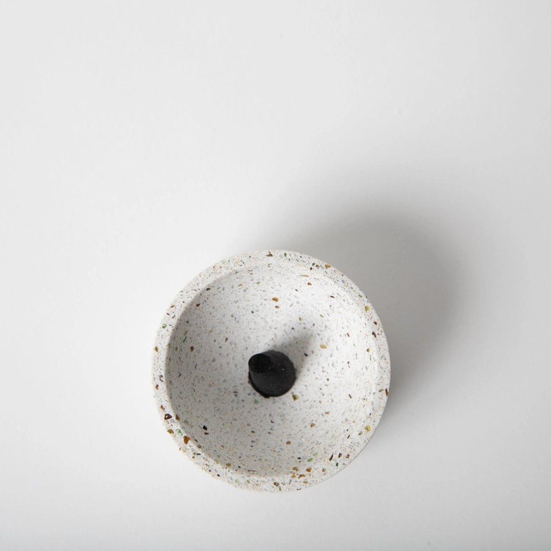 This terrazzo concrete incense vessel is pretty neat. It's not only durable, but also sustainable. The concrete gives it a sturdy feel, and knowing it's eco-friendly adds a bit of peace of mind. It's like a low-key way to keep things relaxed without 