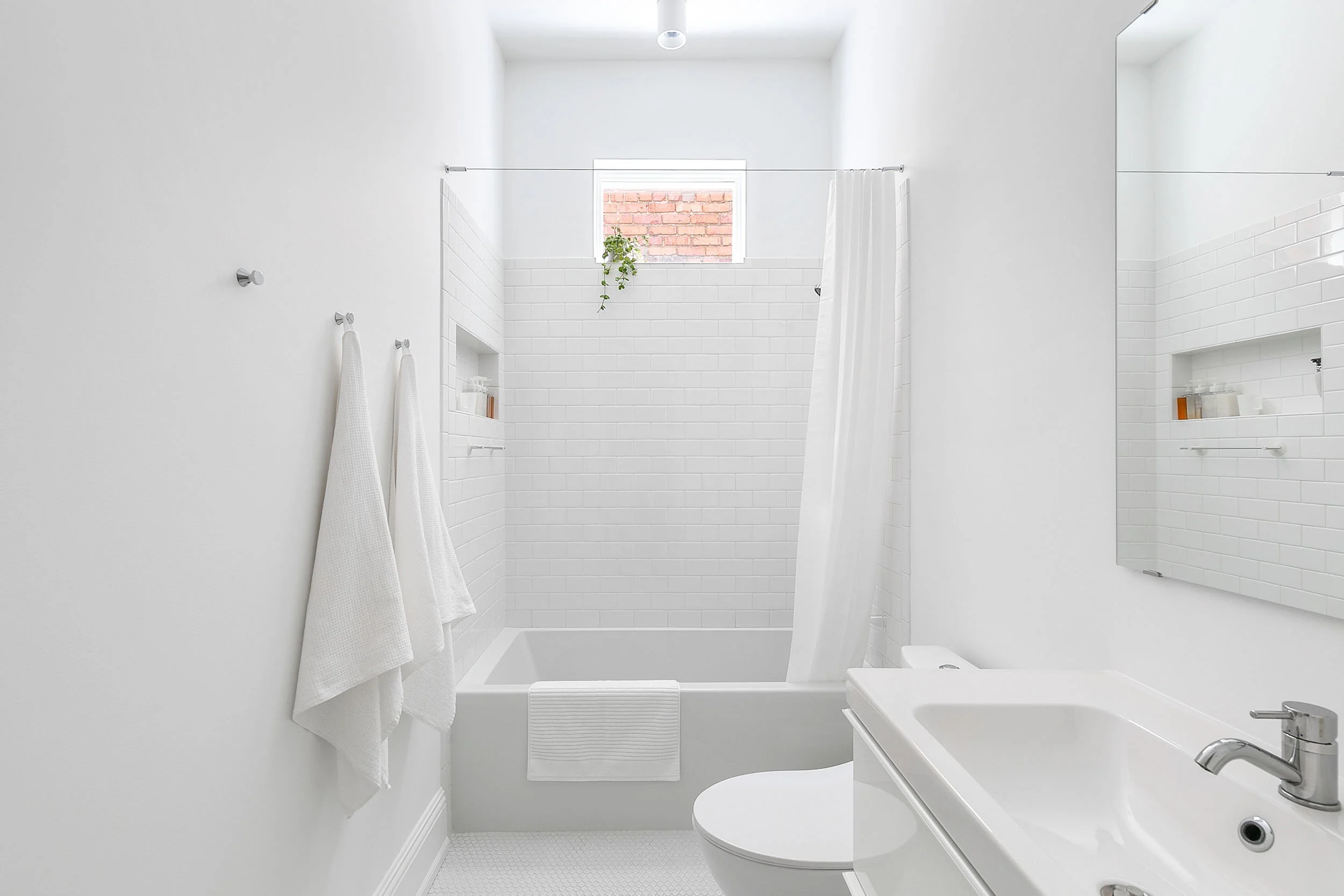 Minimalist all-white bathroom