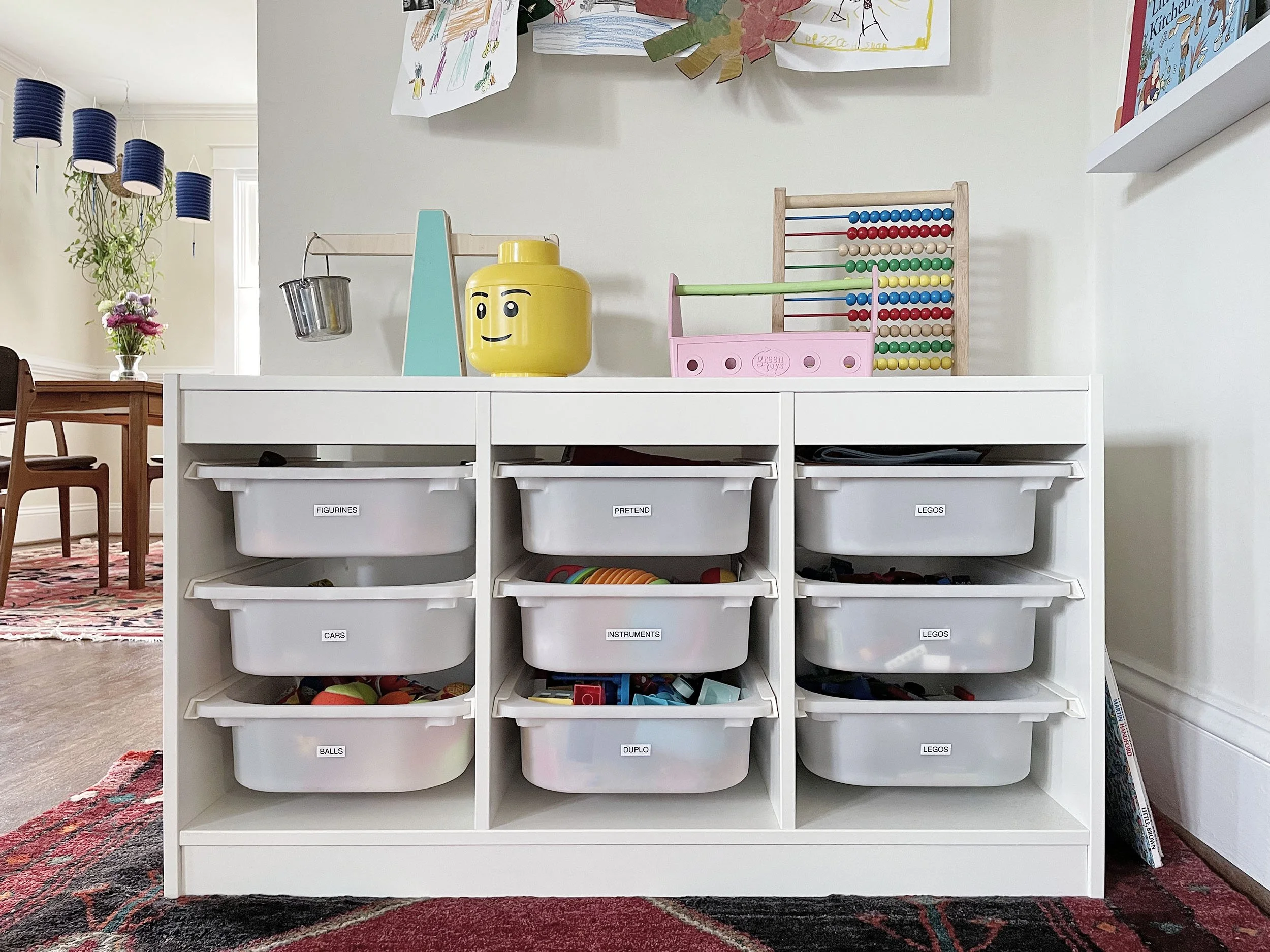 White IKEA TROFAST system with bins for toy storage