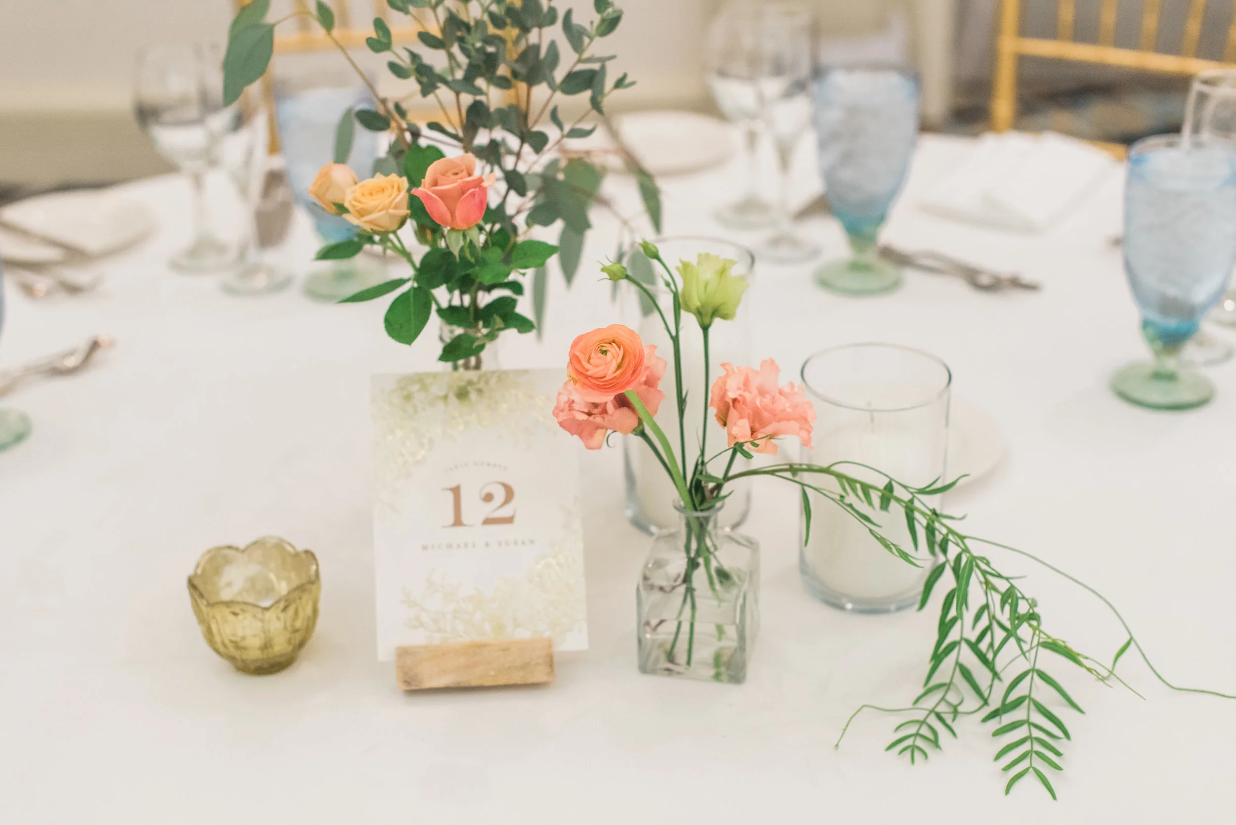 susan and michael wedding with cluster events table flower.jpg