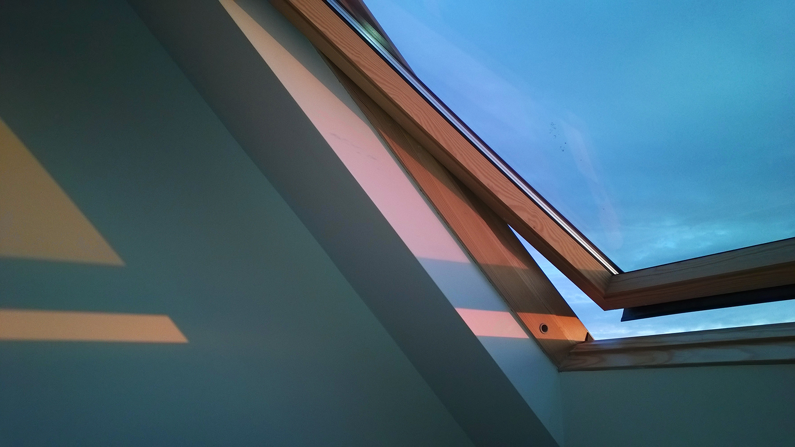 Sunset through velux window, Brighton, UK. Photograph by Tanya Clarke