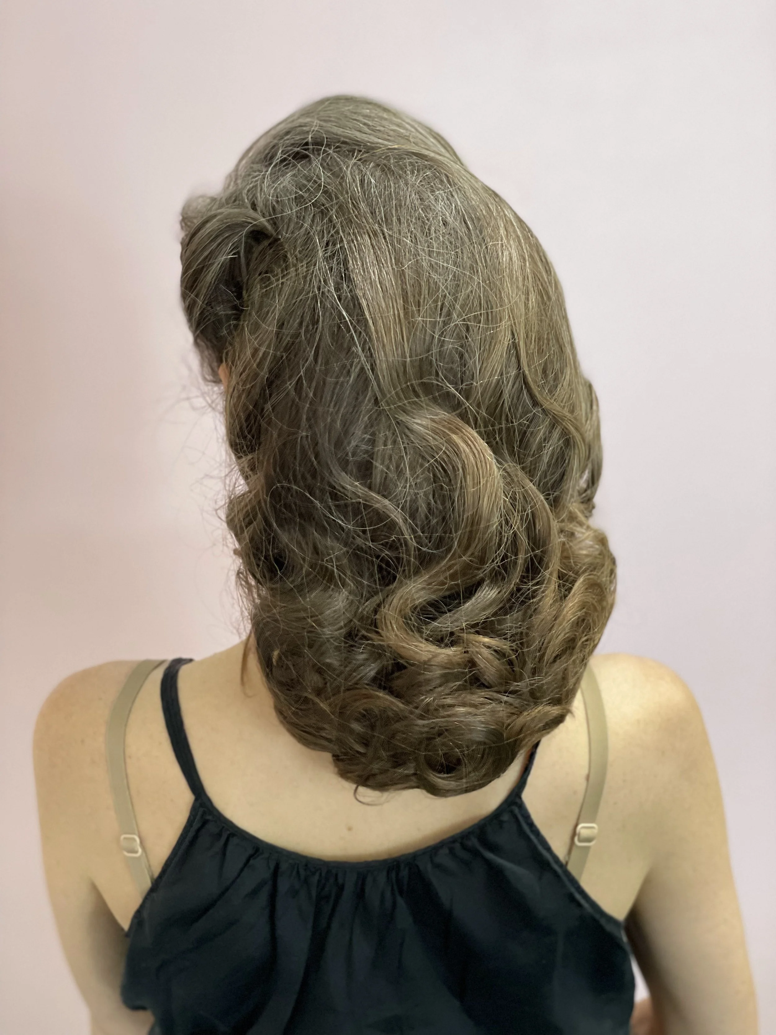 Finished look on talent with preservative hair net, back 