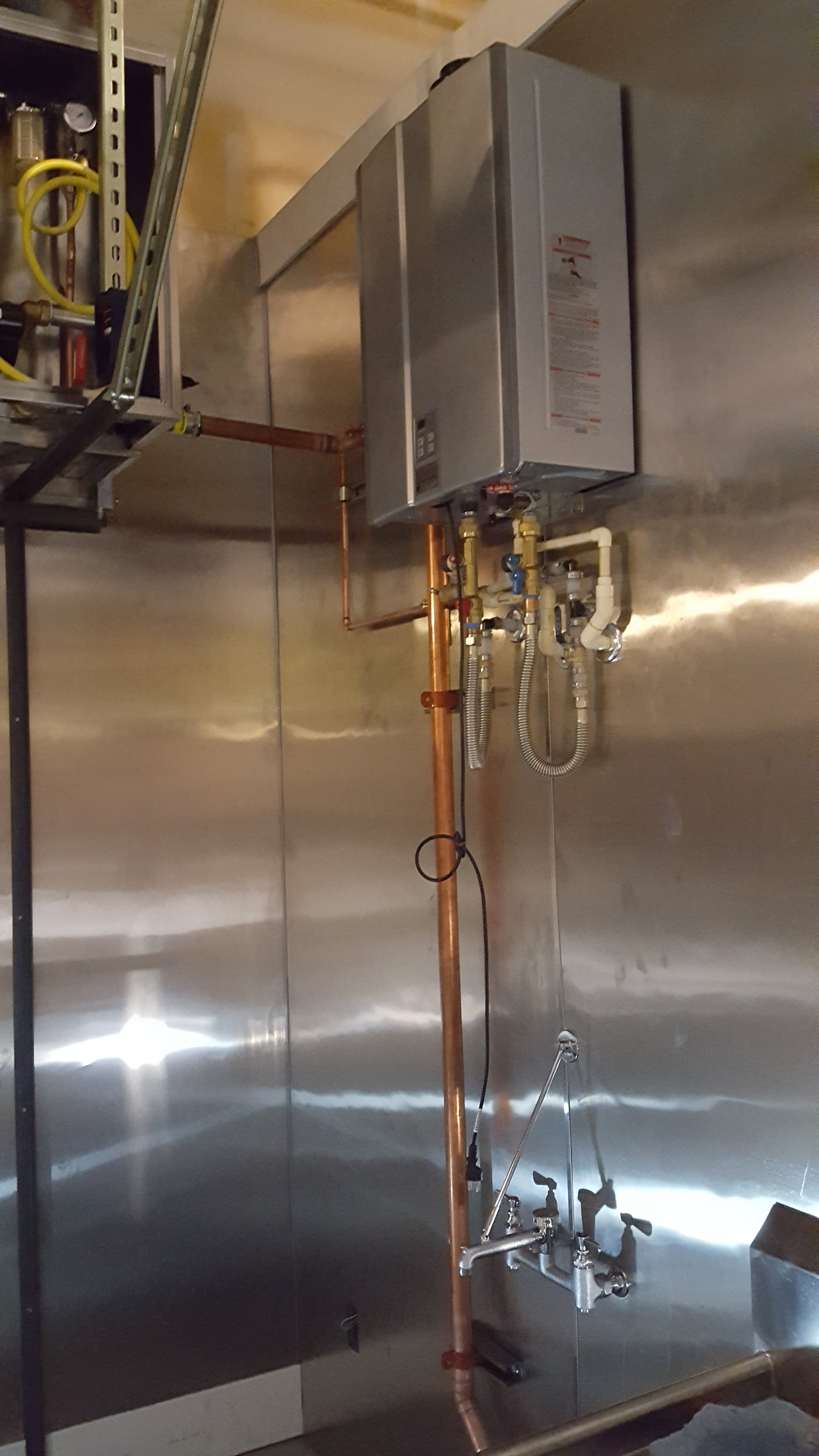 Tankless water heater with re-circulation for restaurant