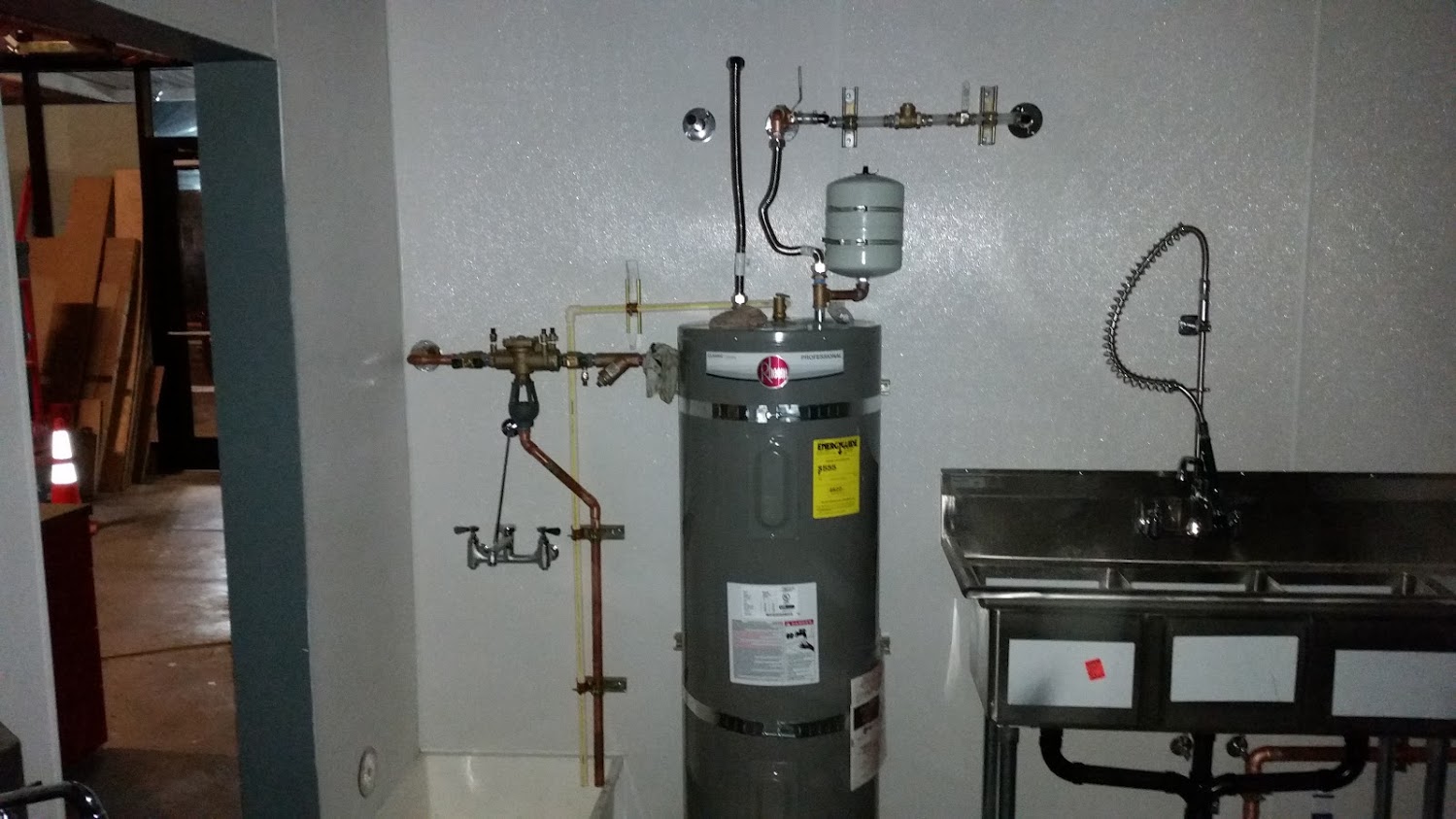 Commercial water heater and reduced pressure backflow device Air Gap Drain into mop sink receptacle 