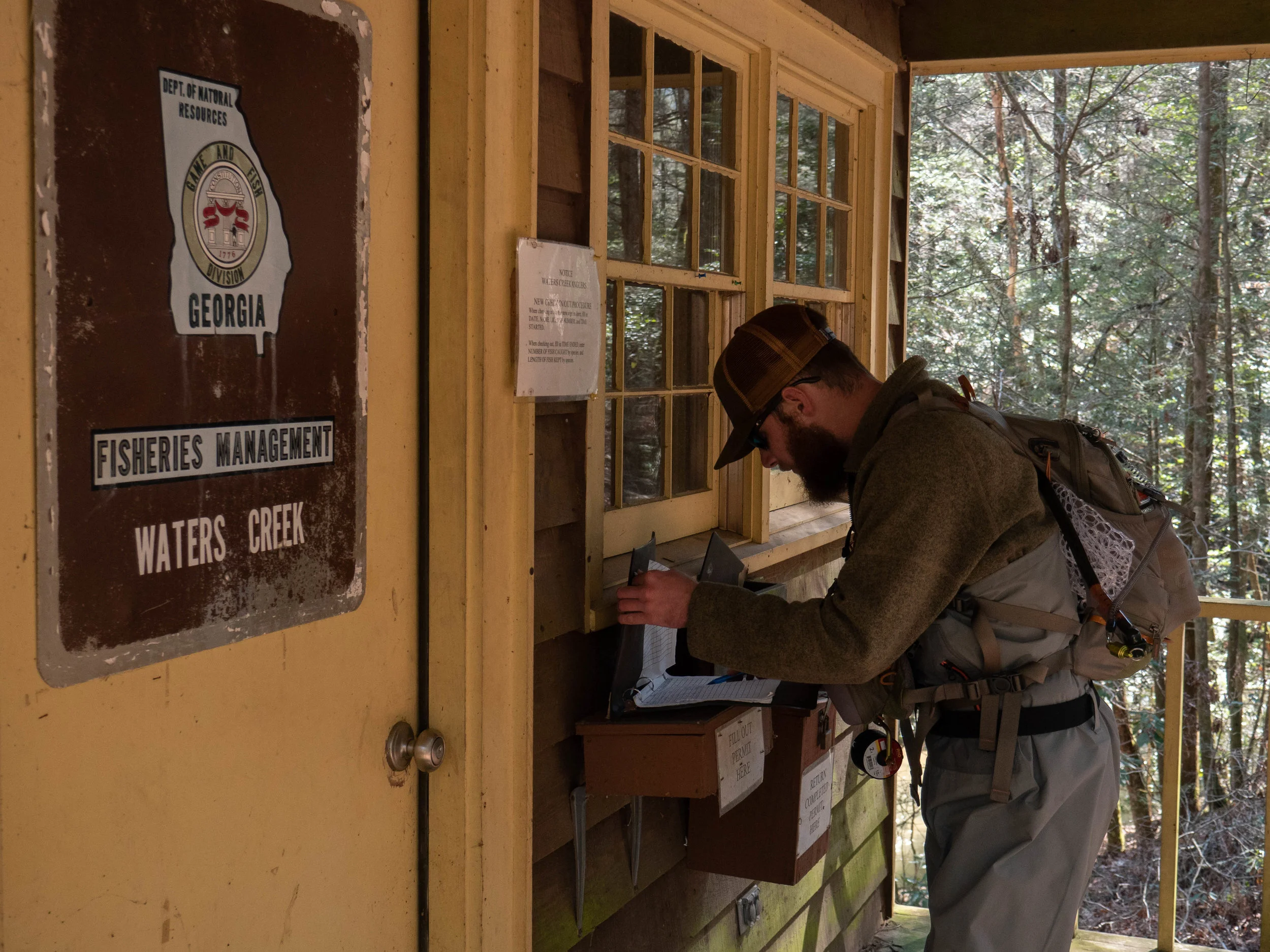 No Kype team member Ben Deal signing in at the ranger station prior to fishing Waters Creek.