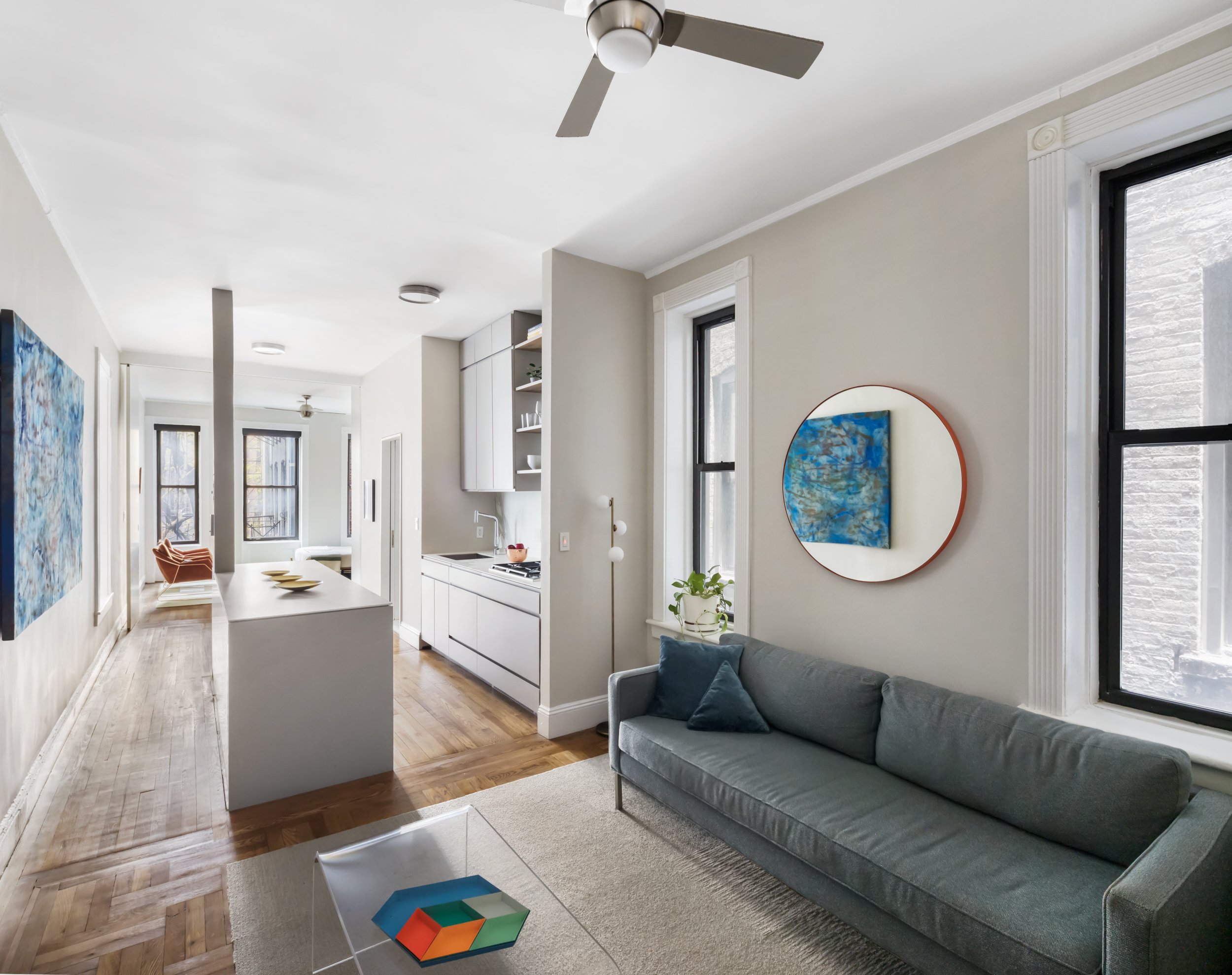 Hell’s Kitchen Residence Fundamental was retained to reimagine a dark, chopped-up walk-up apartment into a light-filled, loftlike apartment for a busy professional in Midtown West. The solution was to remove all of the internal walls to allow the