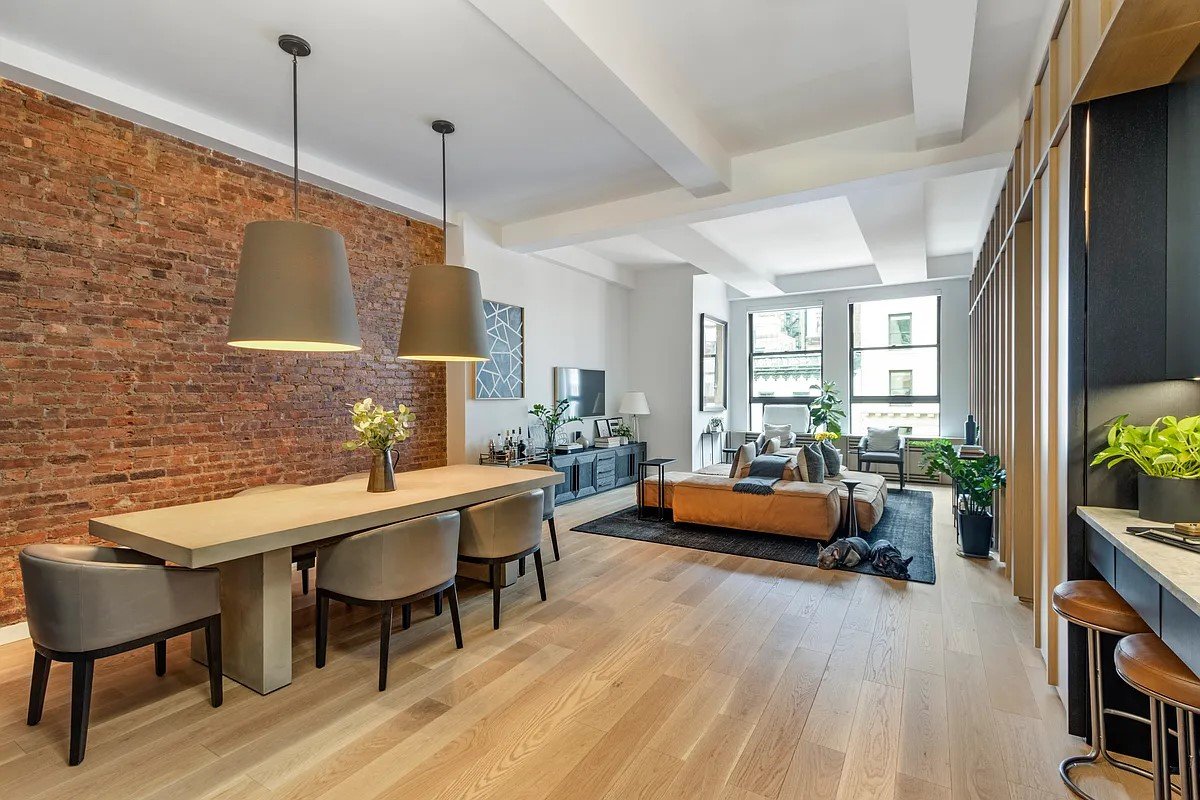 The southeast corner of the apartment is the area where the building’s plumbing and electrical infrastructure pass through the unit. This presented a design opportunity to carve the breakfast / home office nook into the millwork wall contrasted by a
