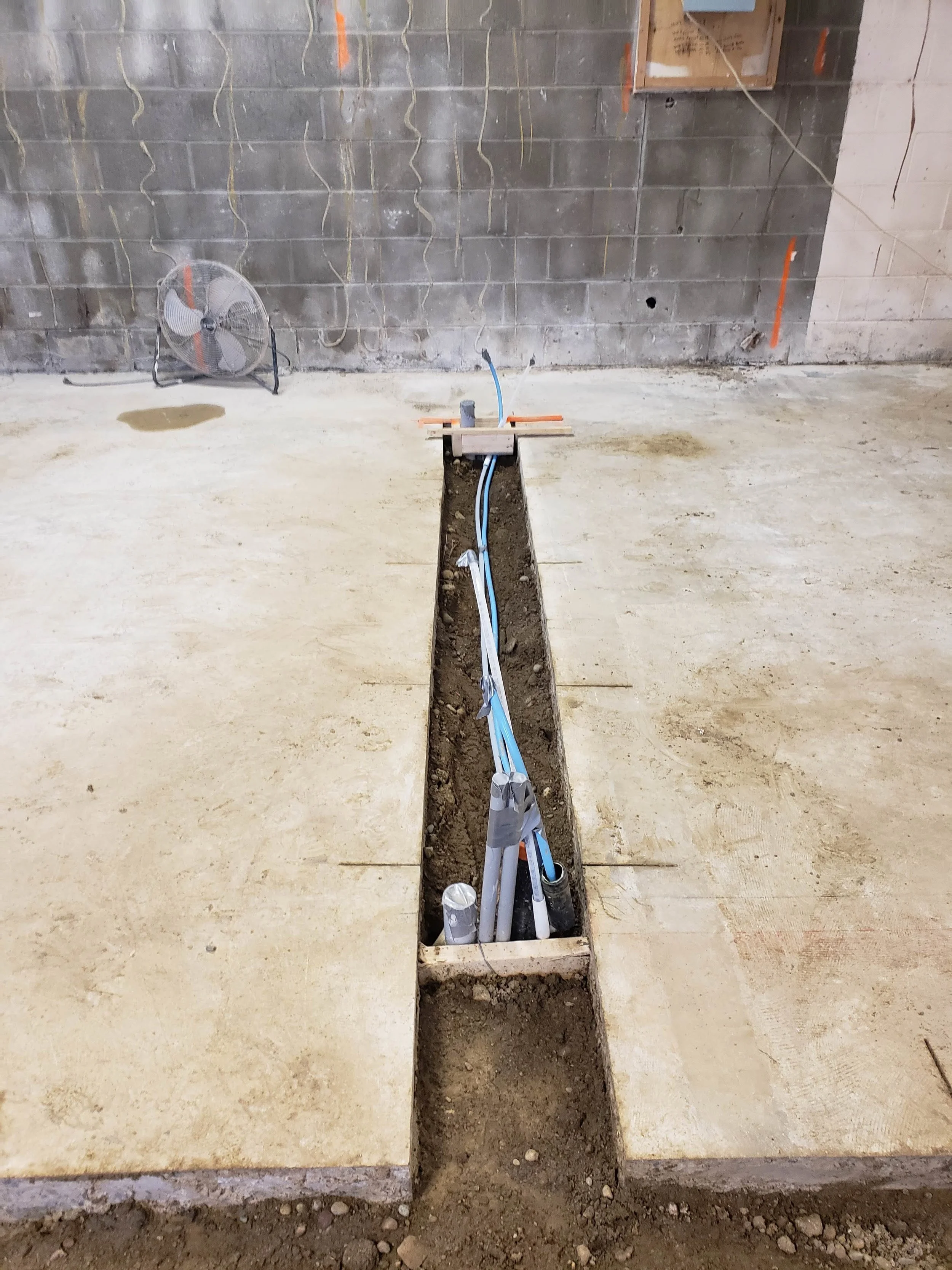 Lots and lots of plumbing goes into a dental office! Drainage, compressed air, water, vacuum, electrical and data conduit lines all ready for the chairs.
