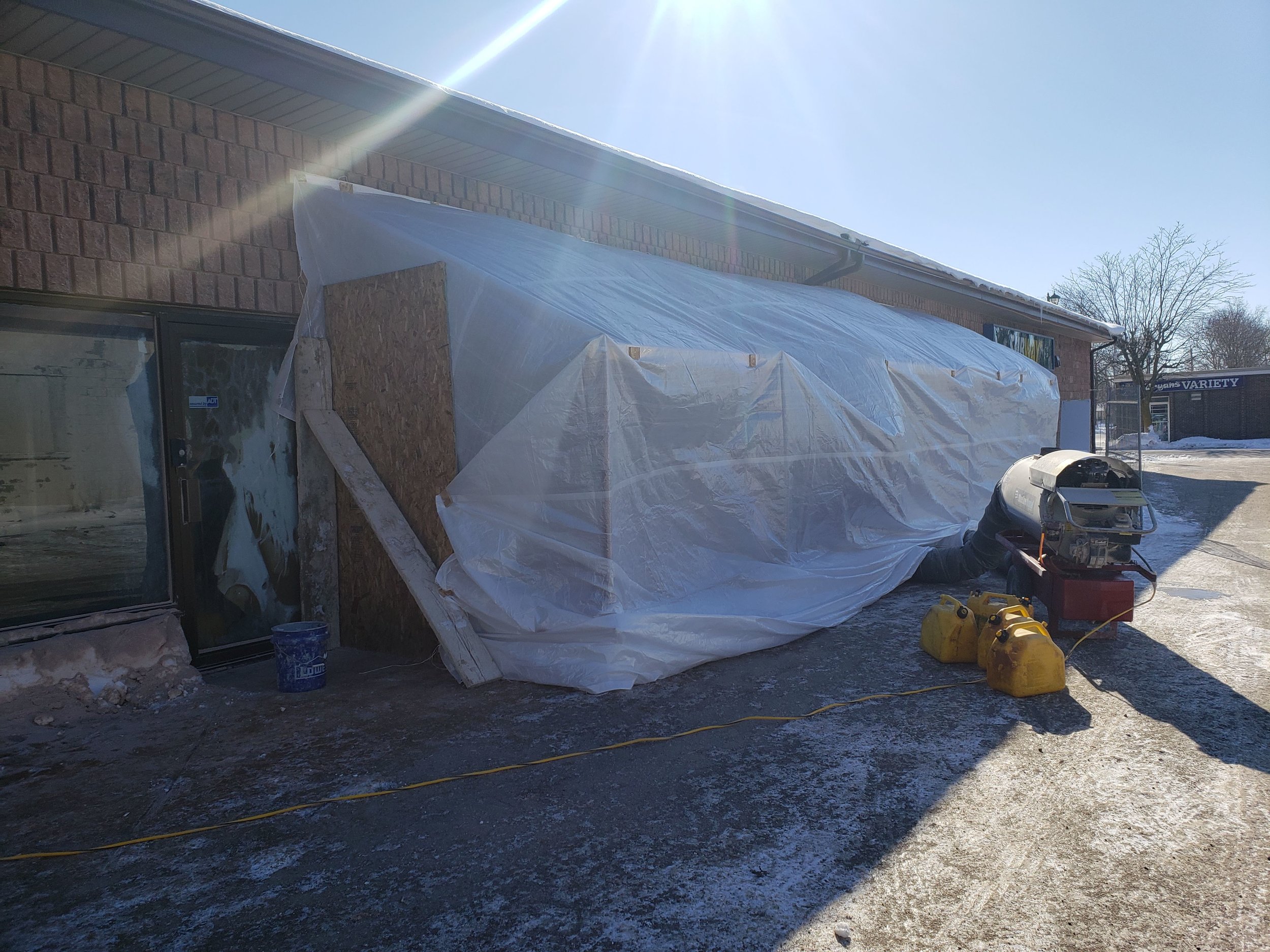 New front windows to reception area are being opened up on another cold day .