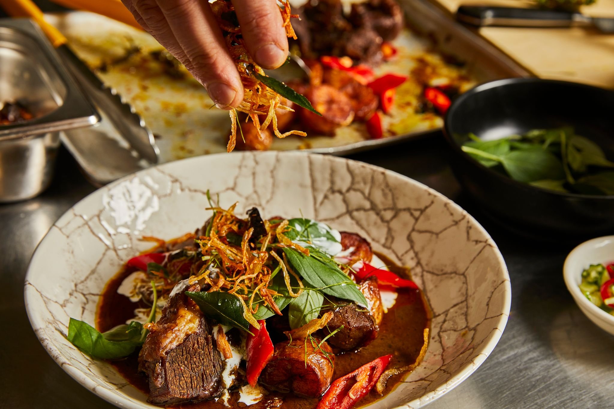 Beef curry of braised Yorkshire beef cheeks with sweet basil, wild ginger, betel leaves & pickles
