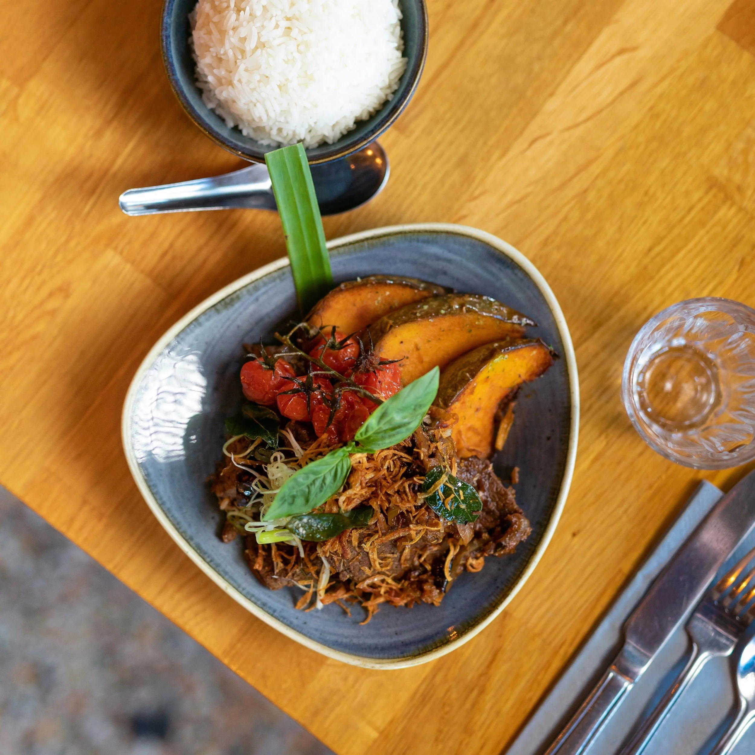 Stir-fried wagyu beef with jaew, roasted pumpkin and Thai basil, served with jasmine rice