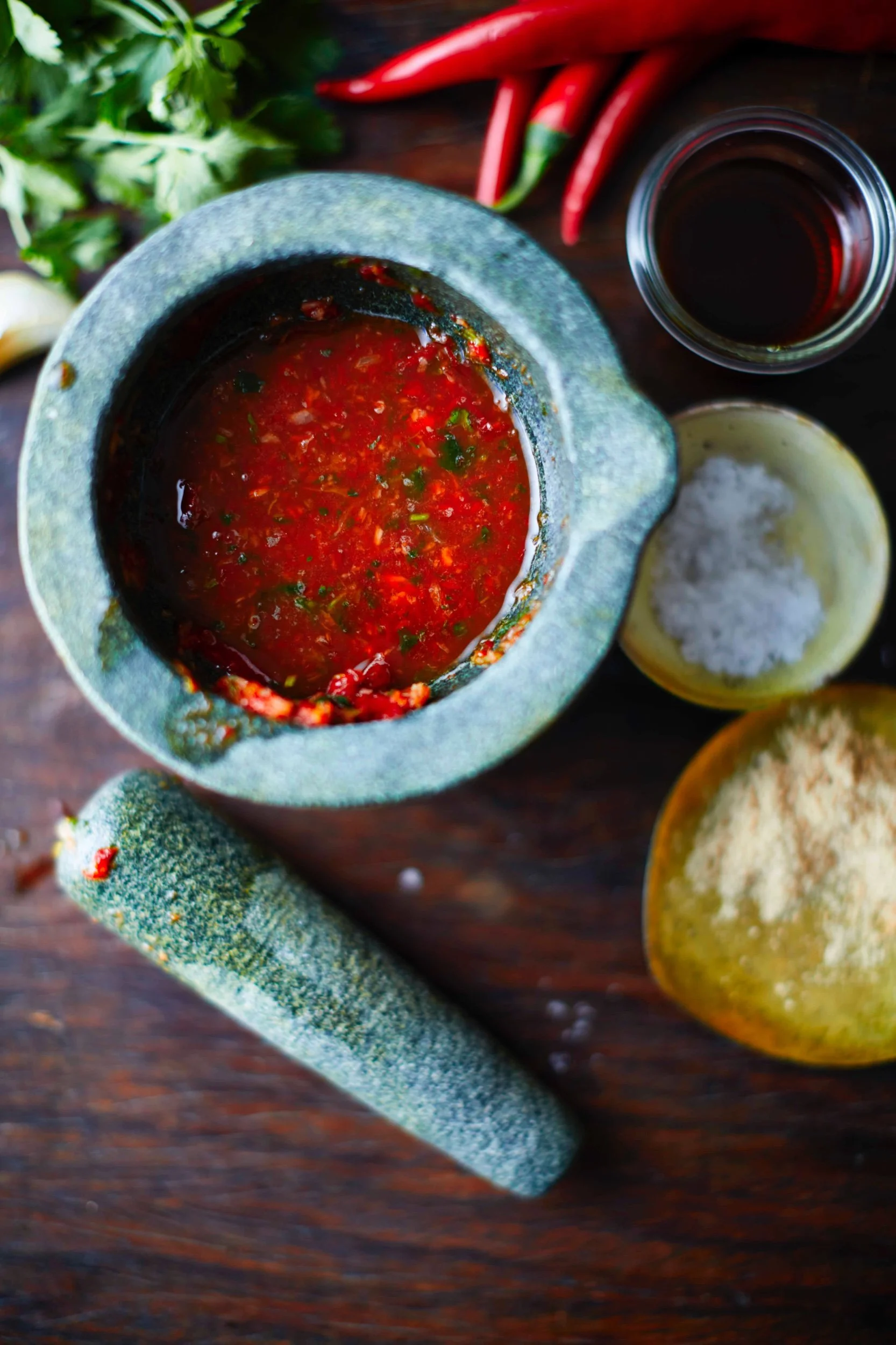 Red nahm yum Thai chilli and citrus dressing in a stone pestle and mortar, recipe by Sebby Holmes