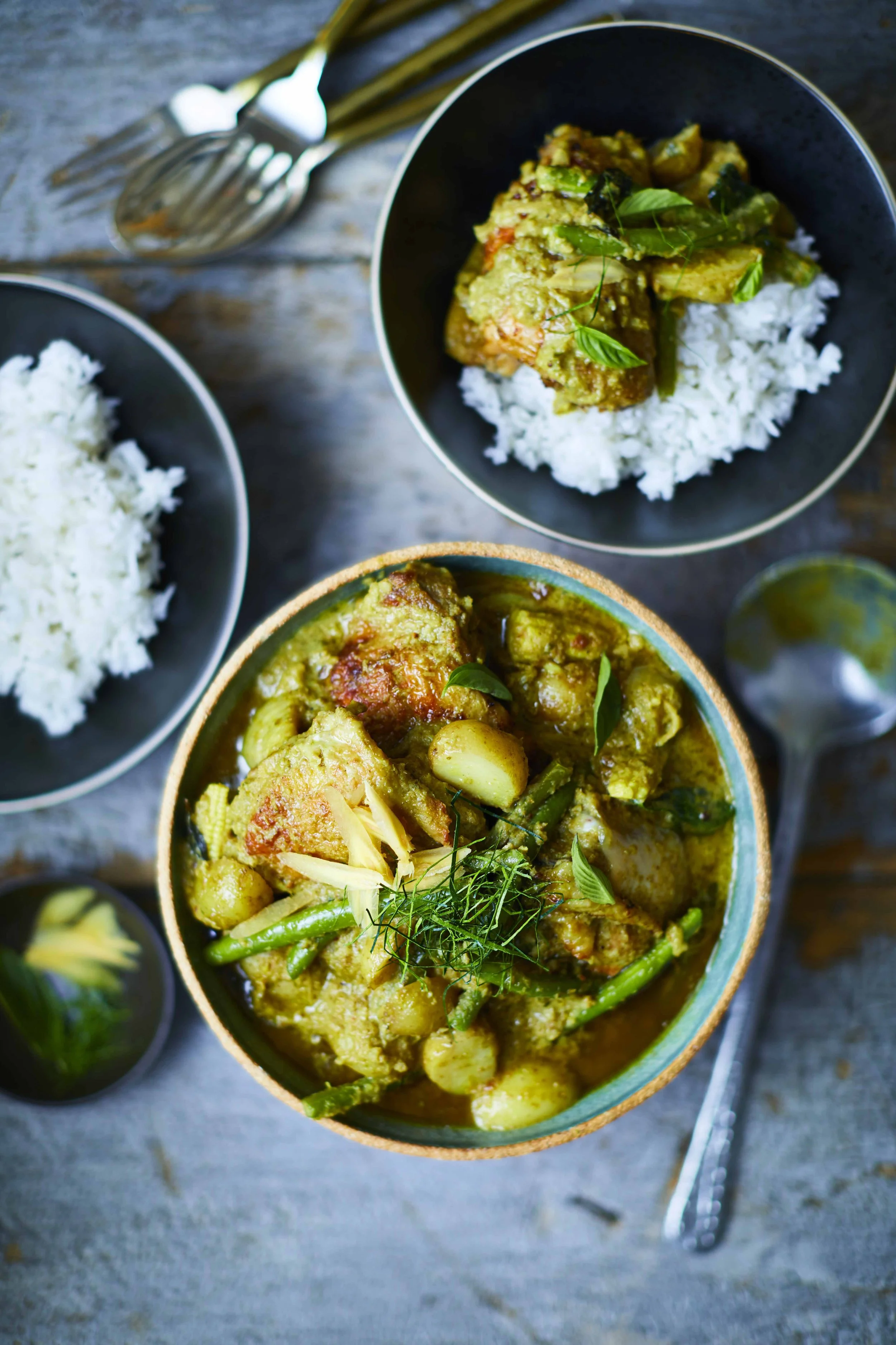 Thai green curry in a ceramic bowl with jasmine rice, photographed at Farang London, by Sebby Holmes.