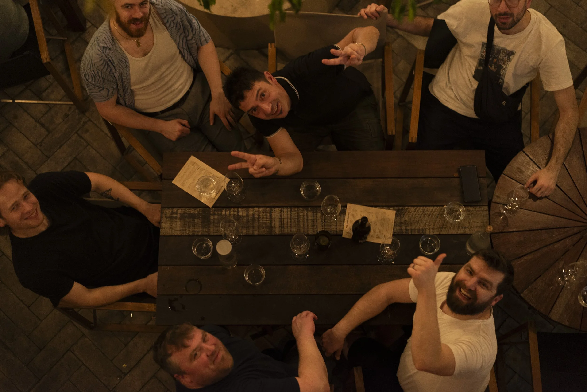 The Farang London team photographed from above at a restaurant table, by Sebby Holmes.