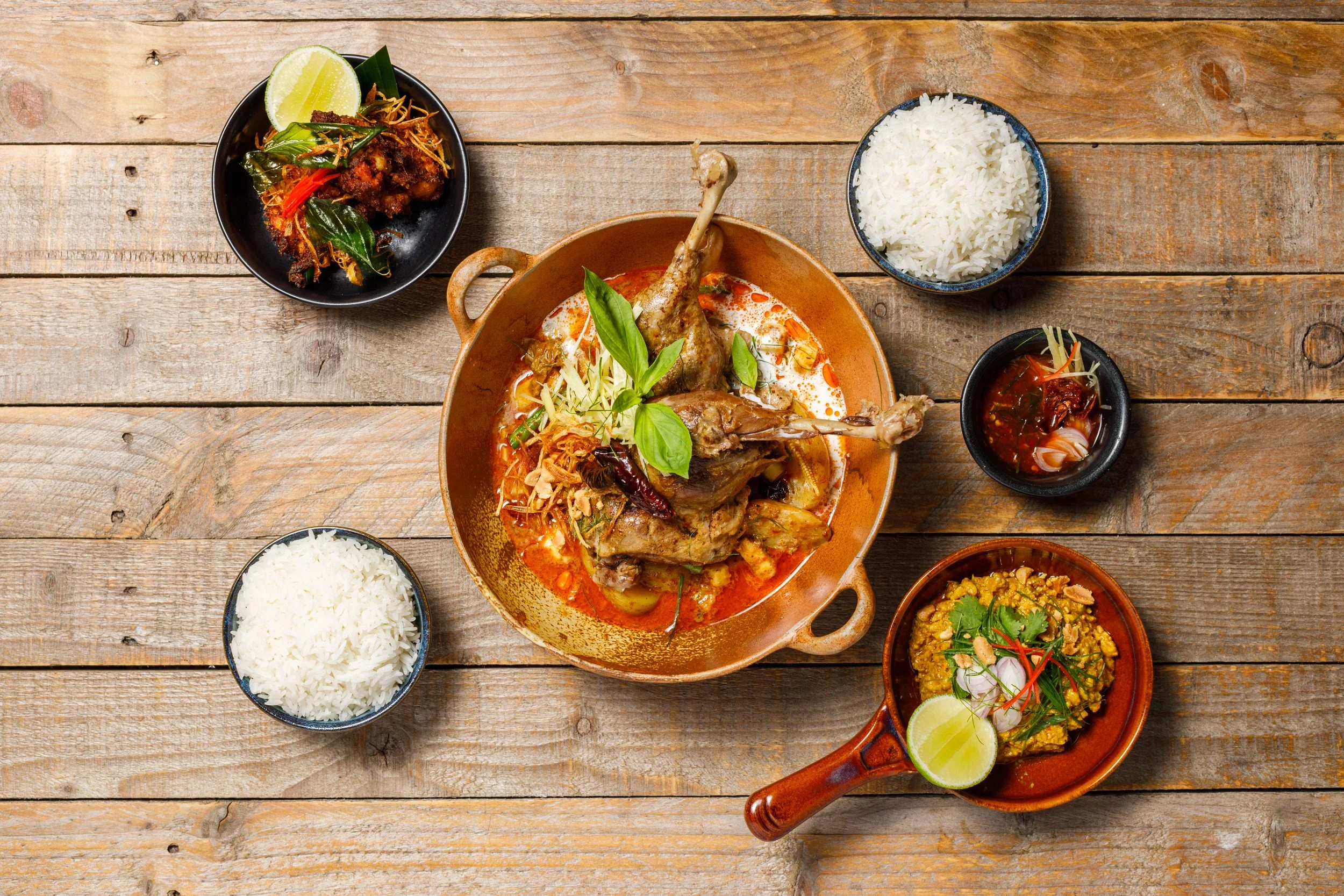 Braised duck leg massaman, with roasted pineapple, salt toasted potatoes and Thai basil, recipe by Sebby Holmes