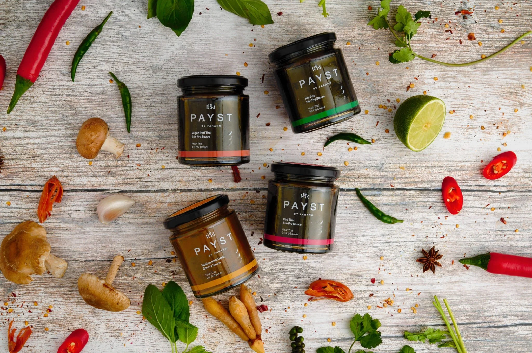 Payst by Farang product range including curry pastes and chilli sauces in bottles and boxes, photographed by Sebby Holmes.