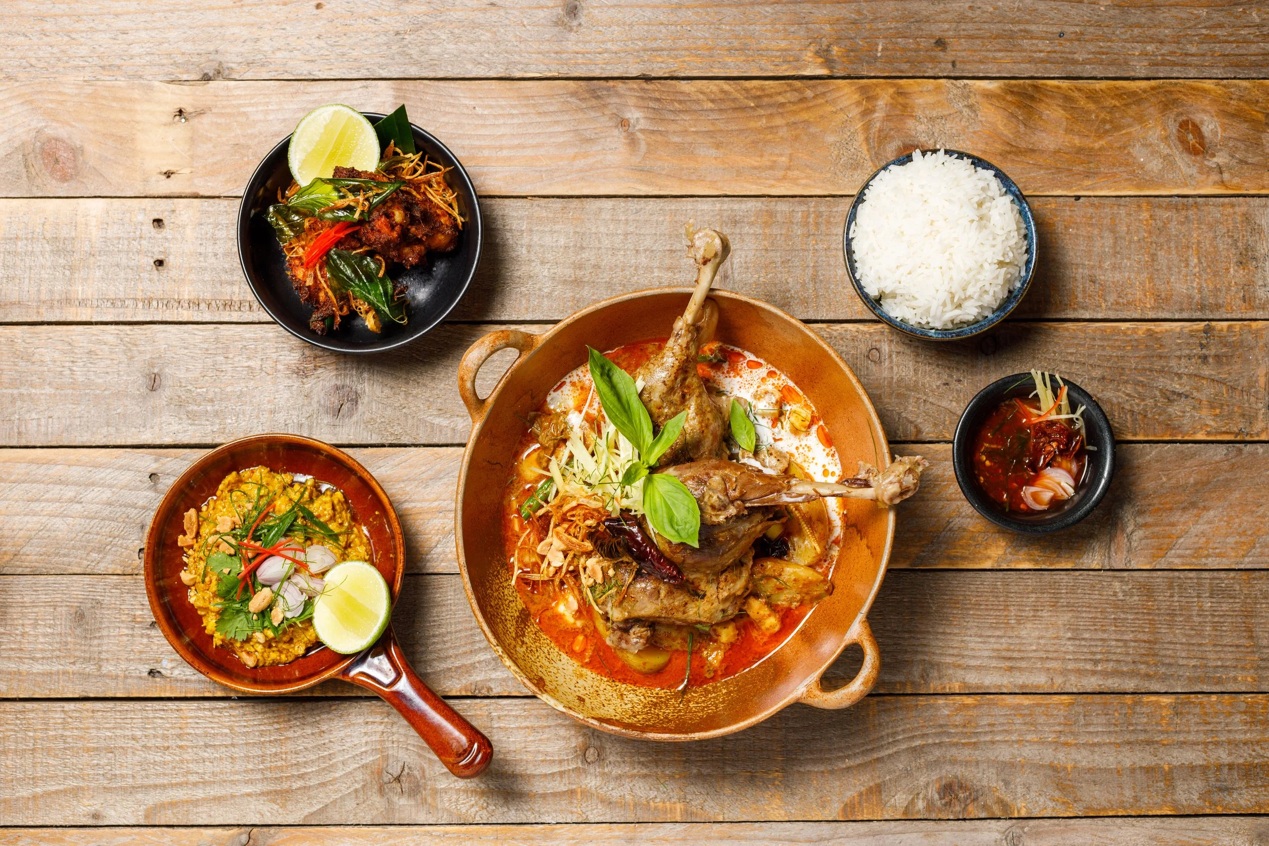 Braised duck leg massaman, with roasted pineapple, salt toasted potatoes and Thai basil, recipe by Sebby Holmes