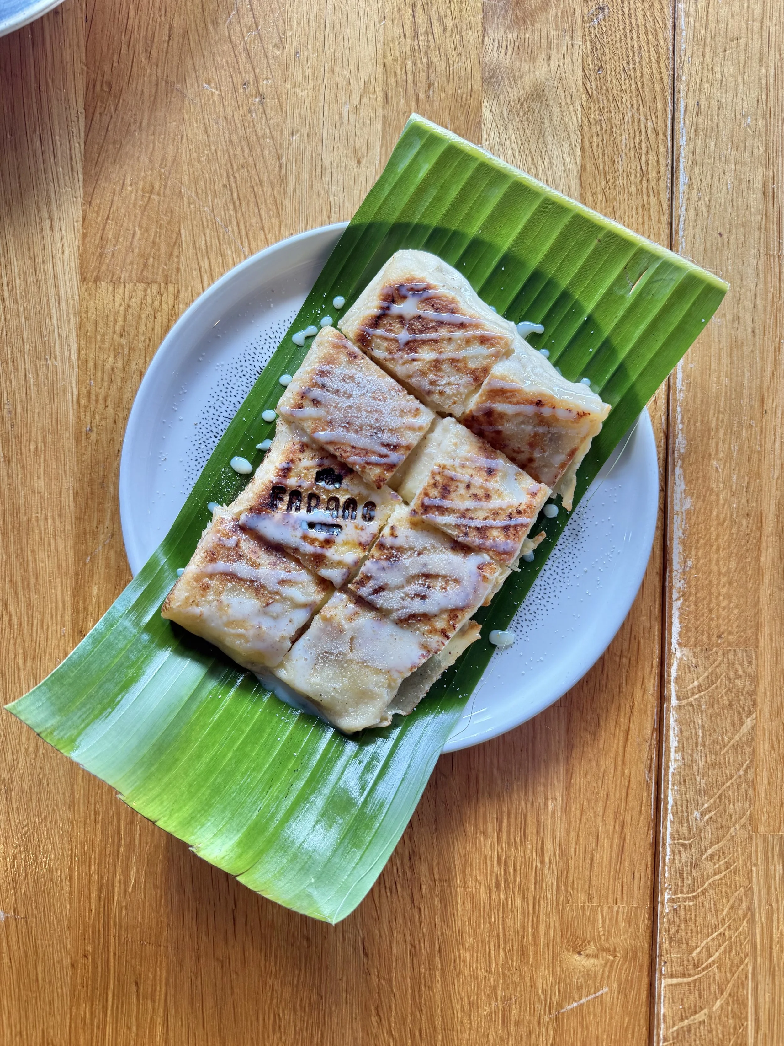 Banana roti with condensed milk and cassia bark sugar on a banana leaf, recipe by Sebby Holmes