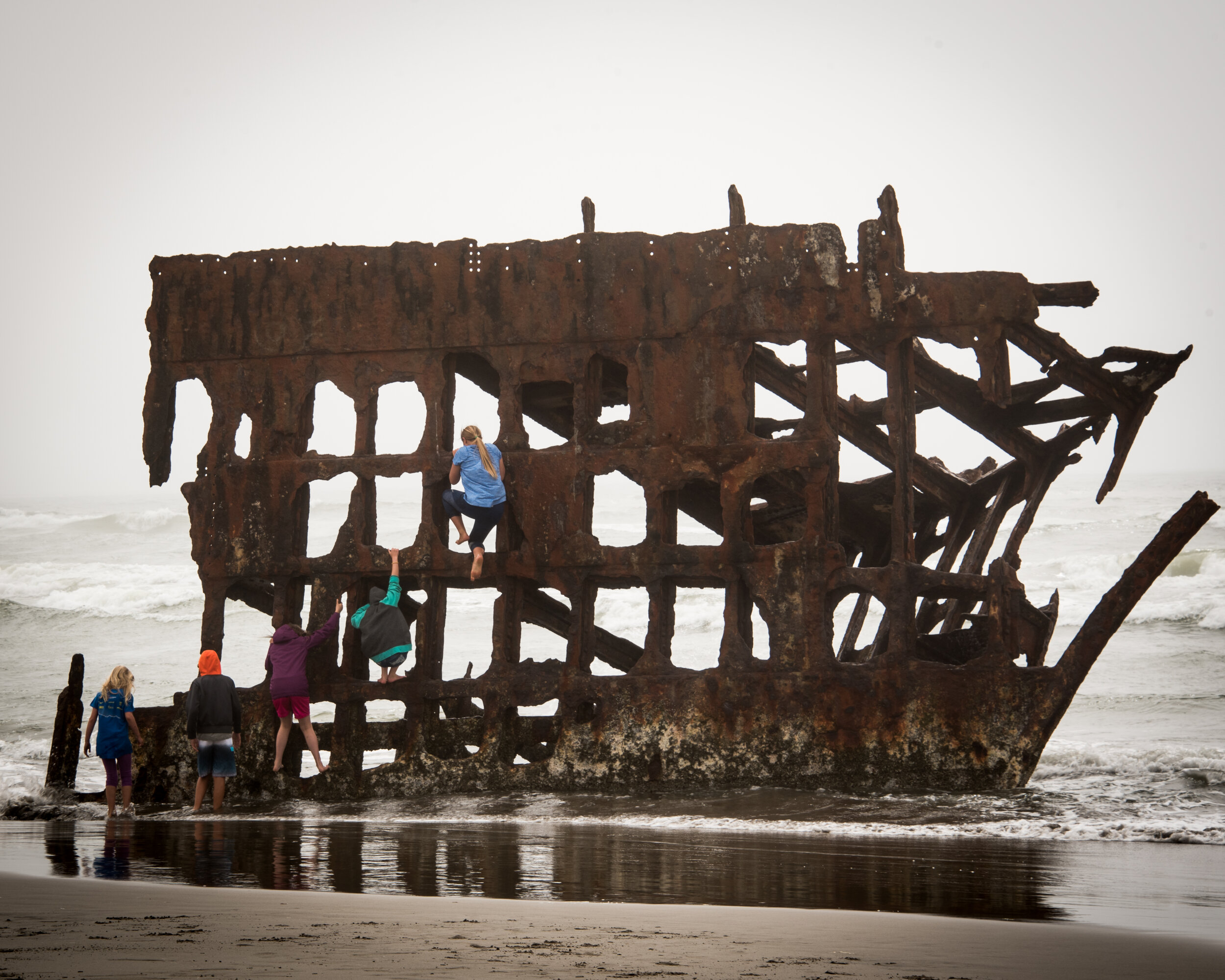 Kids Climbing Peter Iredale Shipwreck