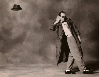 A COOL MILLION (1990) Adapted from Nathanael West’s 1933 short novel, A Cool Million is a savage farce of greed and political manipulation—a Depression era Candide. In a caustic take on one of Horatio Alger’s books for boys, "A Cool Million (Or the Dismantling of Lemuel Pitkin)" traces the adventures of a young innocent country boy who leaves home in order to seek his fortunes under the mentorship of Shagpoke Whipple, ex-president of the United States. The work offers a vision of America beset with corrupt institutions, rampant, uncontrolled capitalism, and political leaders who control through unabashed exploitation of patriotic sentiment and traditional family values. The piece is performed as a solo, using rapid, distilled choreography and precise split second transformation within a world of some fifty-odd characters. Performed by Dan Hurlin Sets by John Arnone Lights by Lori Dawson Puppets by Janie Geiser Premiered at Dance Theater Workshop, NYC Toured internationally AWARD : Village Voice Obie Award, Special Citation Photo Credits: Matthieu Roberts
