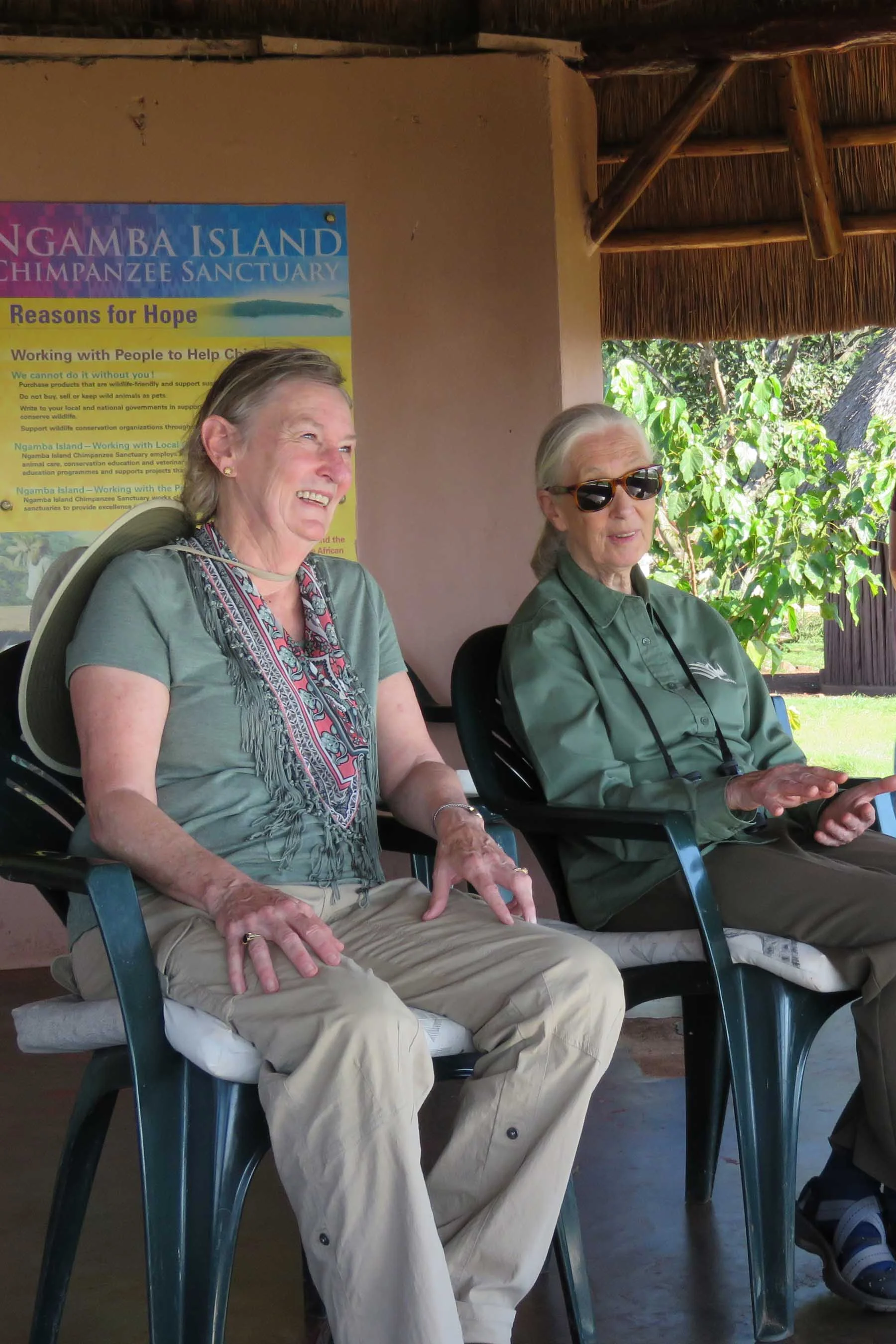 Dr. Merrick relaxes with Dr. Jane Goodall at Ngamba Island Chimpanzee Sanctuary, Uganda, June 2018.