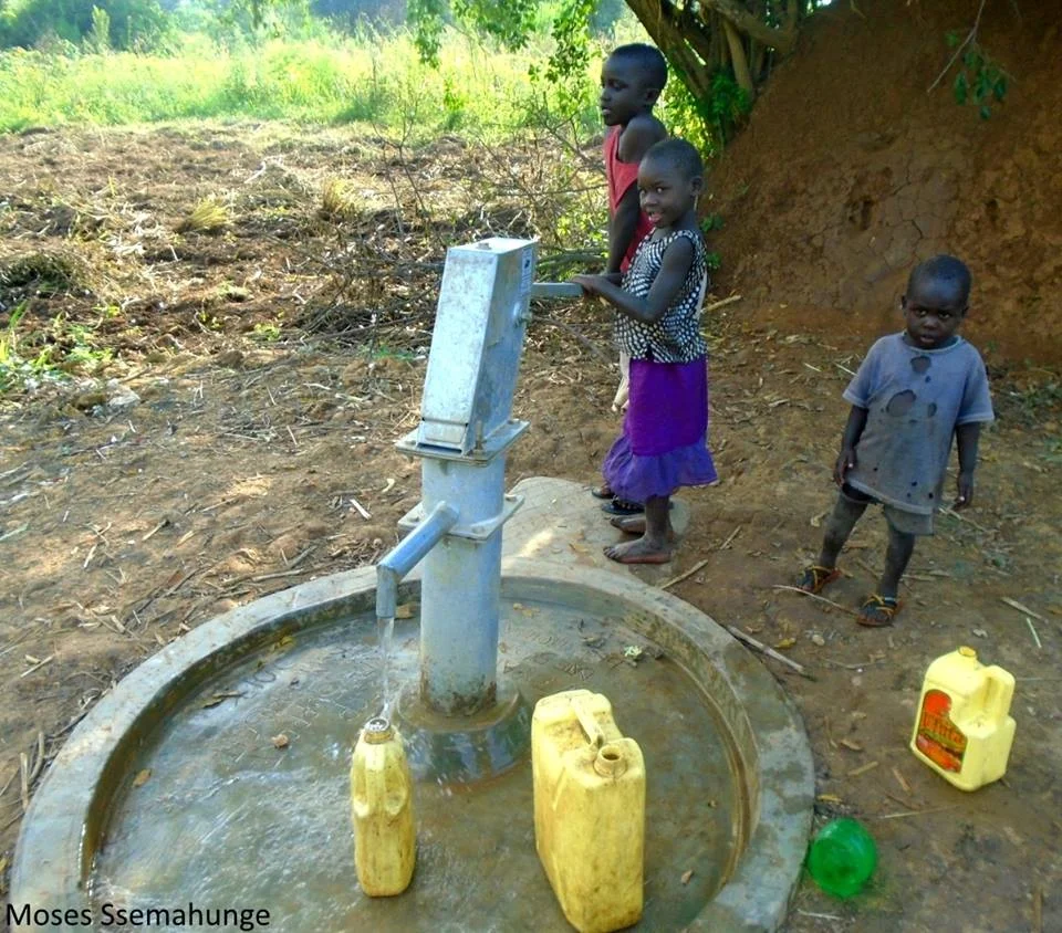 kids using borehole.jpg