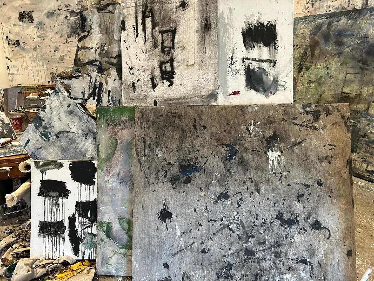 Studio , with a group of paintings stacked together #artstudio #paintings #paintimgsforsale #artlife #comtemporaryart #artist #paintimg ##poetry #lifestyle #interiordesign #interiorarchitect #architect #mixedmedia