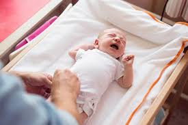 crying baby getting changed.jpeg