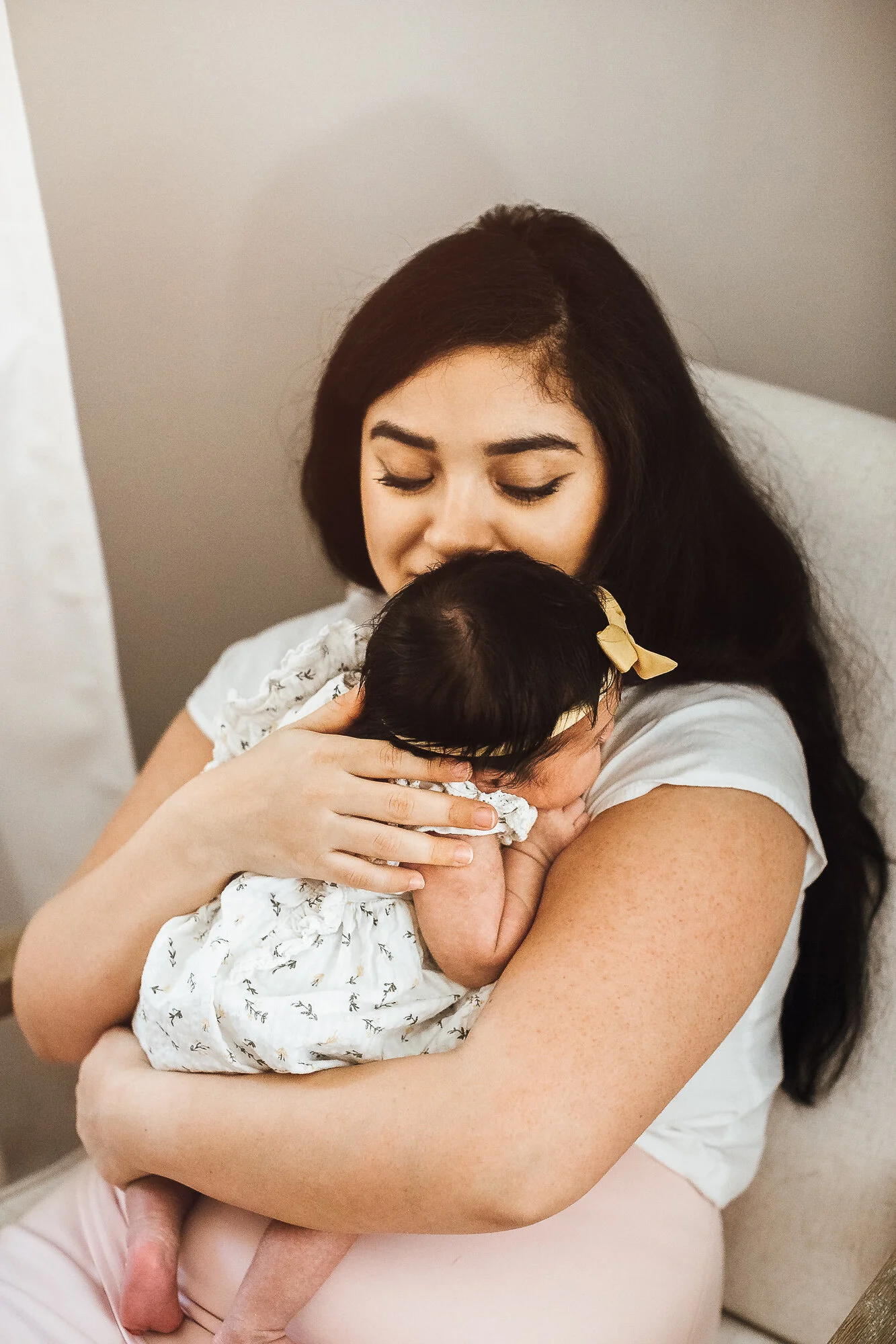 Mother holding newborn baby girl