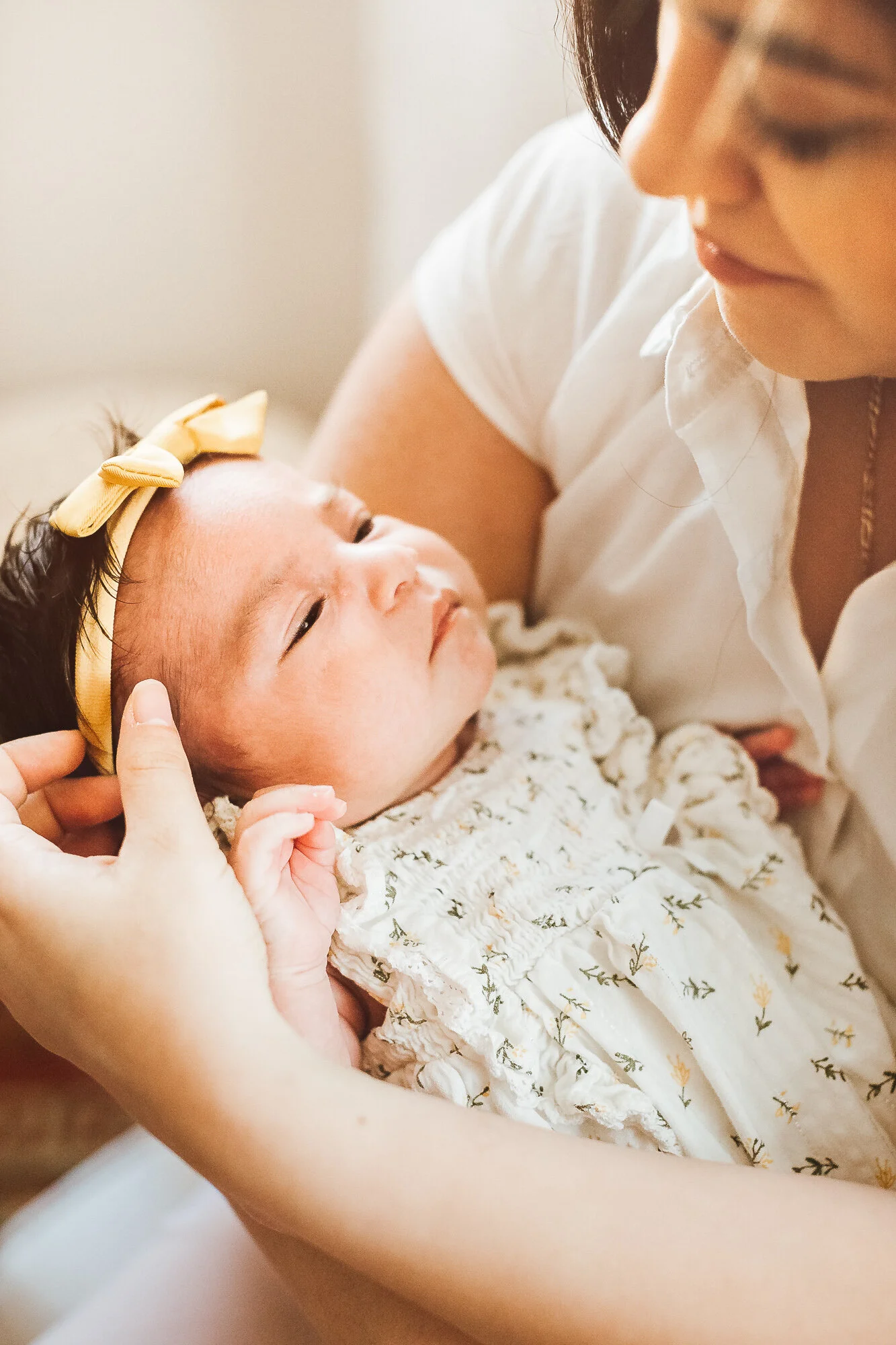 Mother holding newborn baby girl