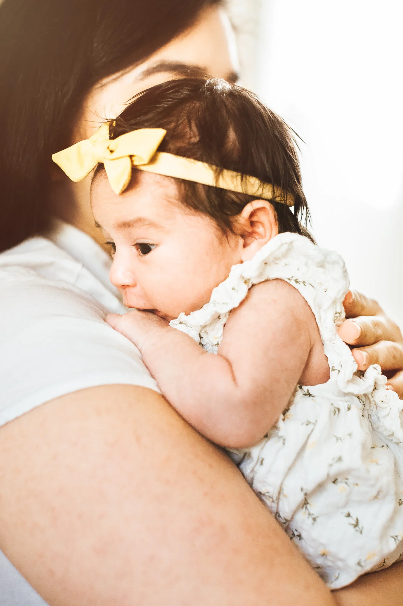Mother holding newborn baby girl
