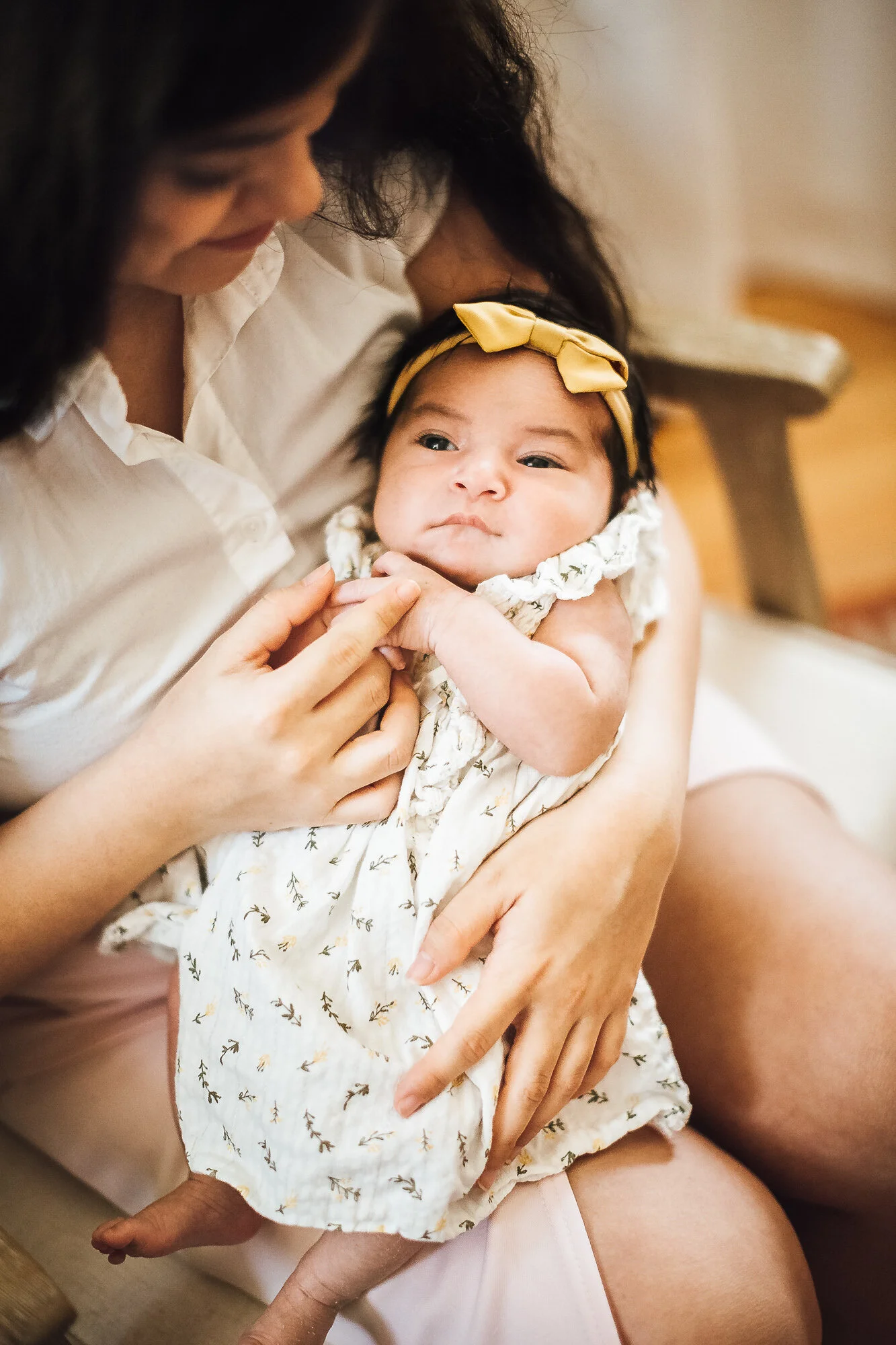 Mother holding newborn baby girl
