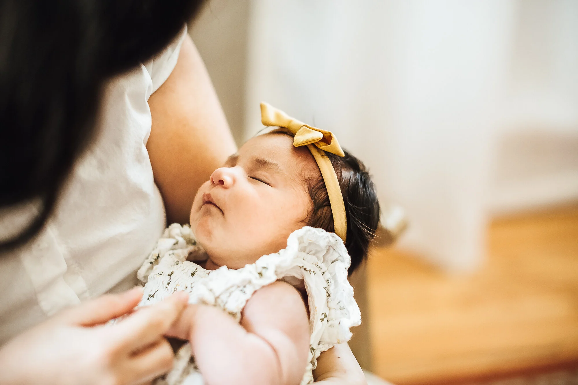 Mother holding newborn baby girl