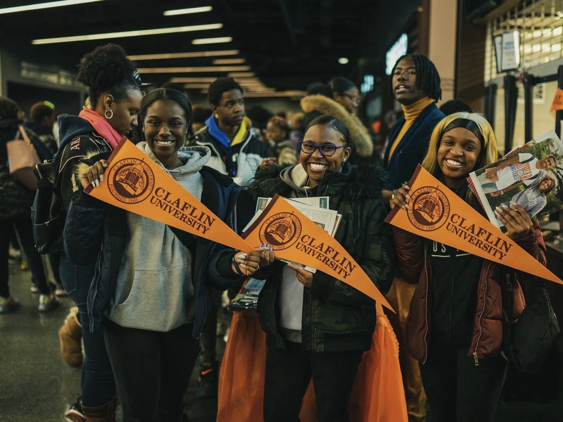 COLLEGE FAIR STUDENTS WITH ADMISSIONS MATERIALS.jpg