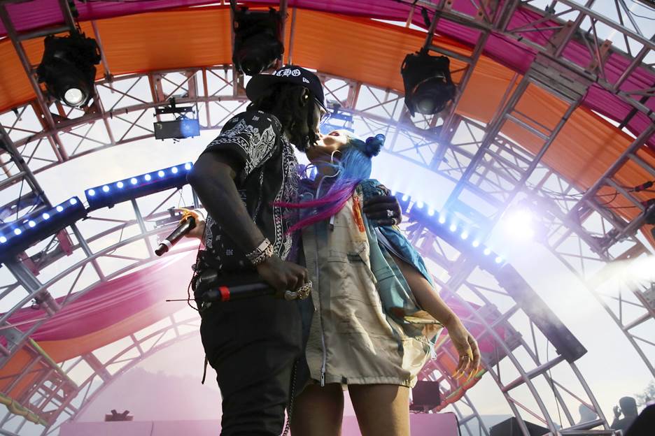 Cardi B and husband Offset share a kiss on stage at #REVOLVEfestival
