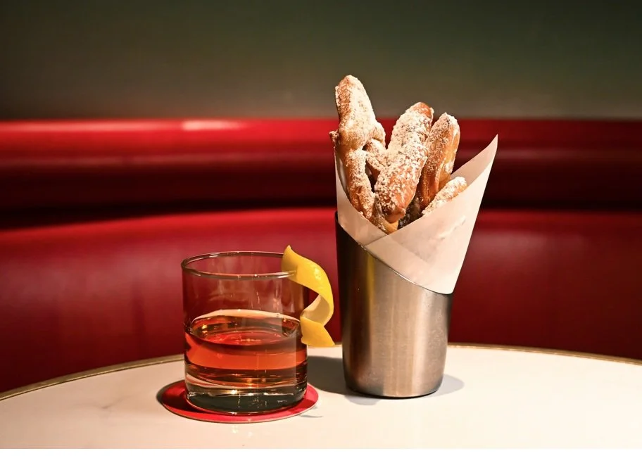 Sazerac Cocktail with beignets at Grand Brasserie for Mardi Gras - Photo Credit Curated Saga.jpg