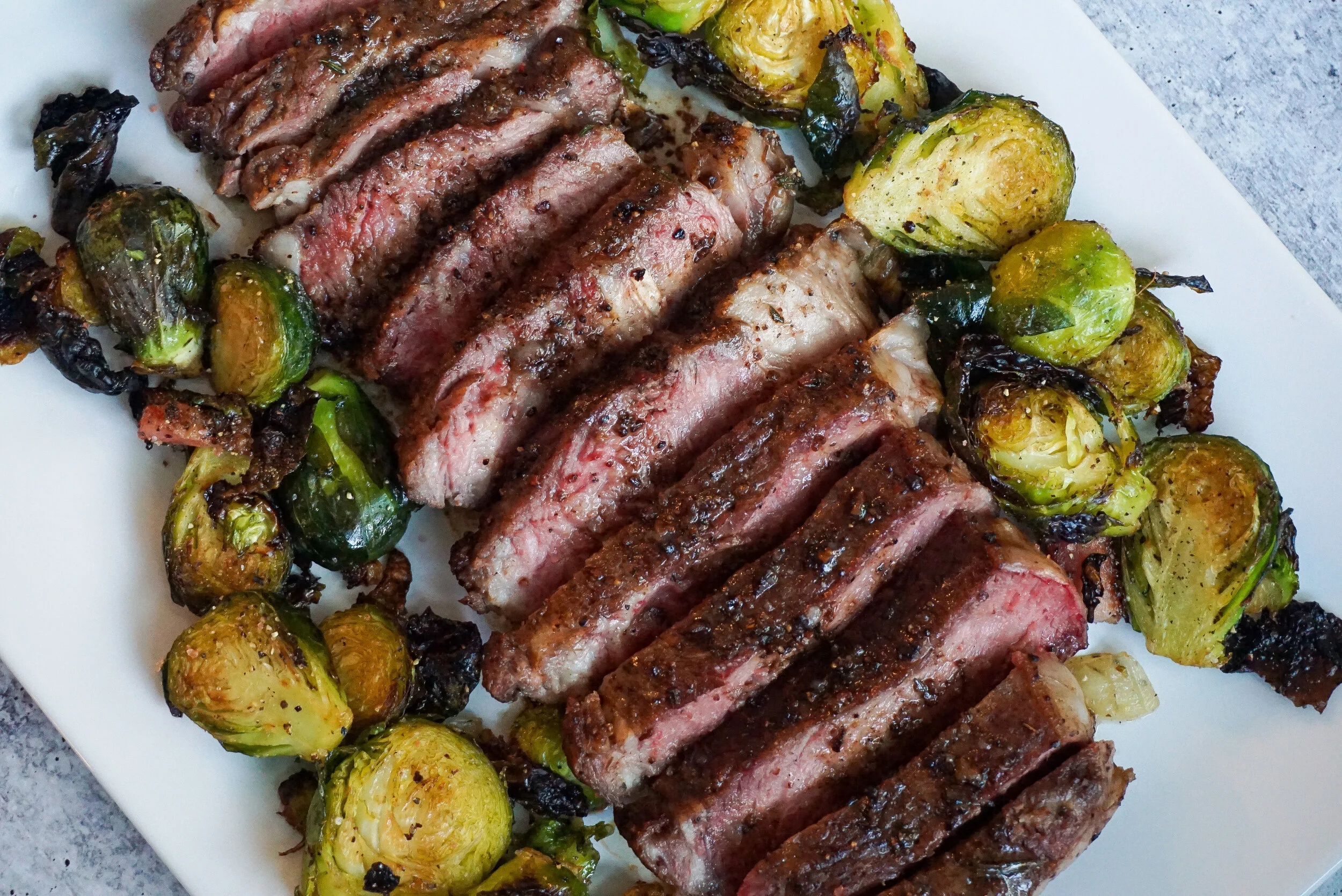 cast iron ribeye with roasted brussel sprouts